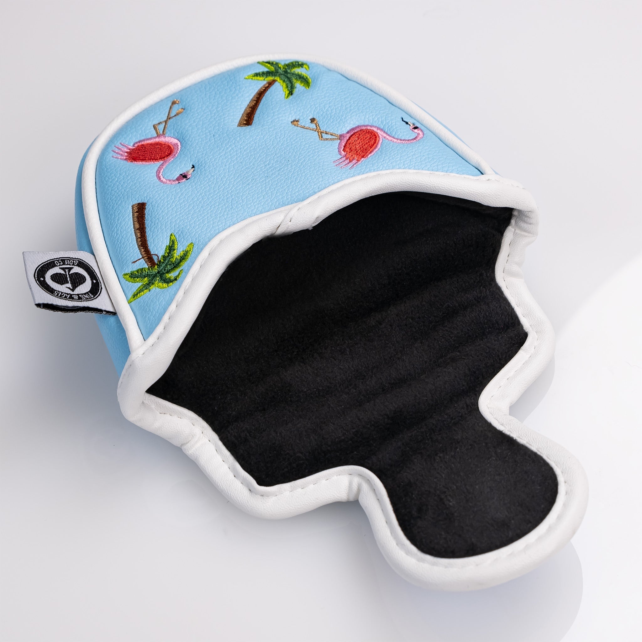 Dancing Flamingos mallet putter cover featuring a vibrant blue design with embroidered flamingos and palm trees.