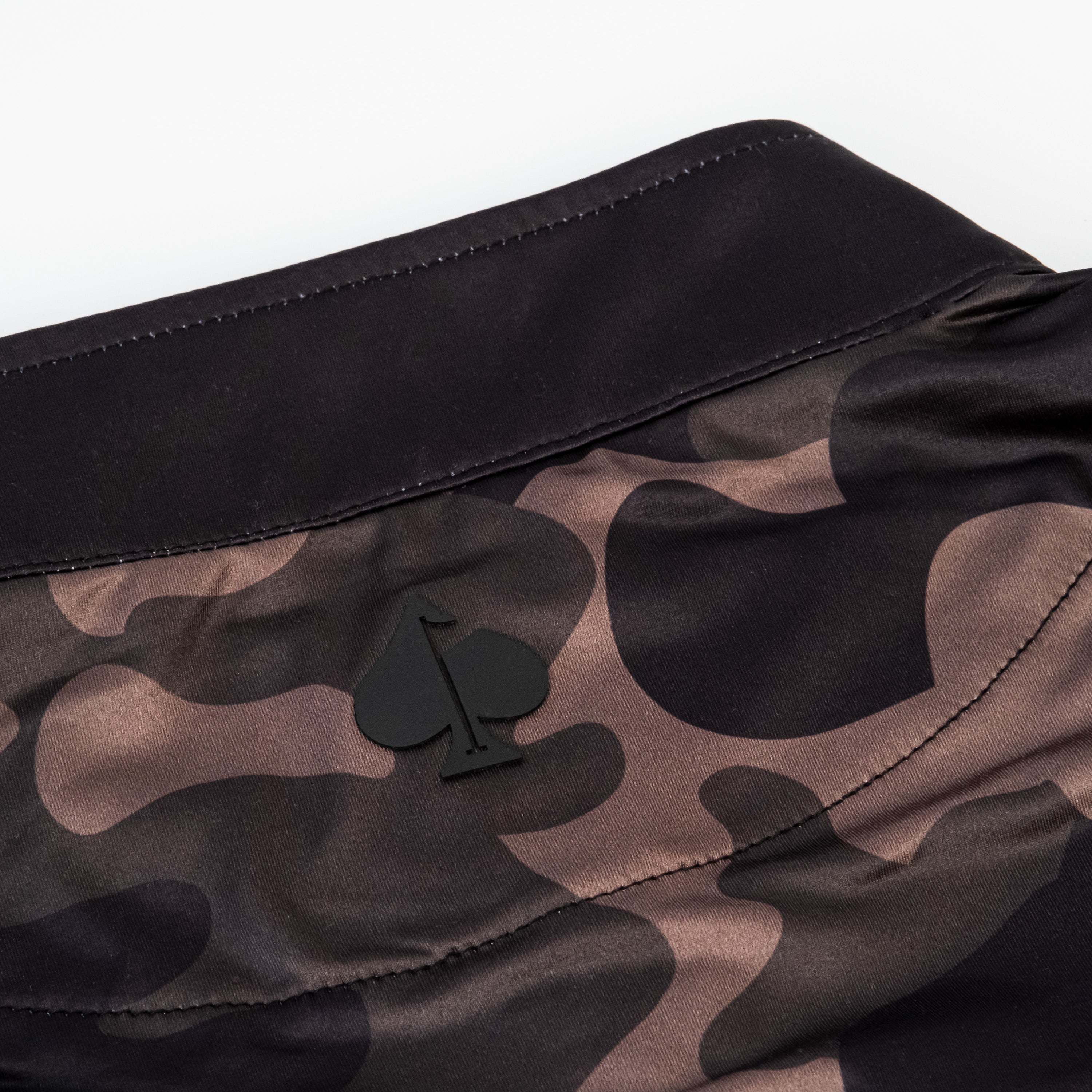Dark Forest Camo Pullover featuring a stylish camo pattern and a subtle logo on the collar, perfect for golfers.
