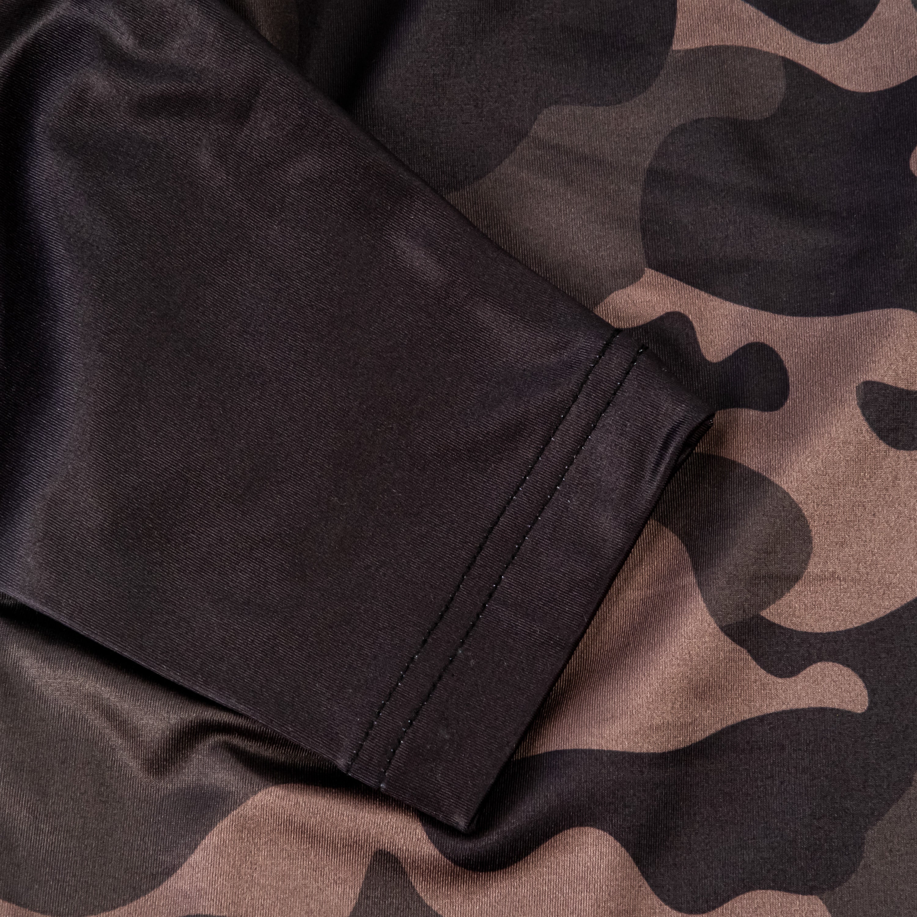 Dark Forest Camo Pullover featuring a sleek design with a blend of dark greens and browns, perfect for stylish golf outings.