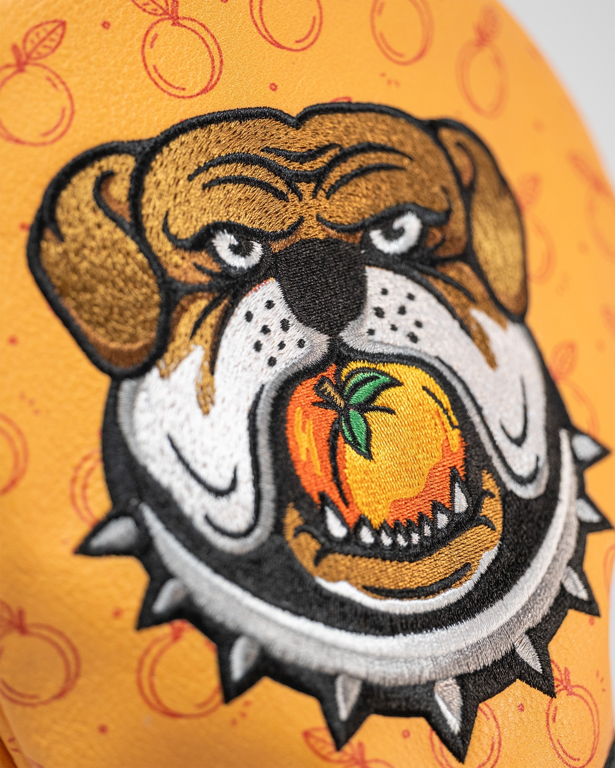 Bold Dawg Country driver cover featuring a fierce bulldog graphic holding an orange, perfect for standout golf style.
