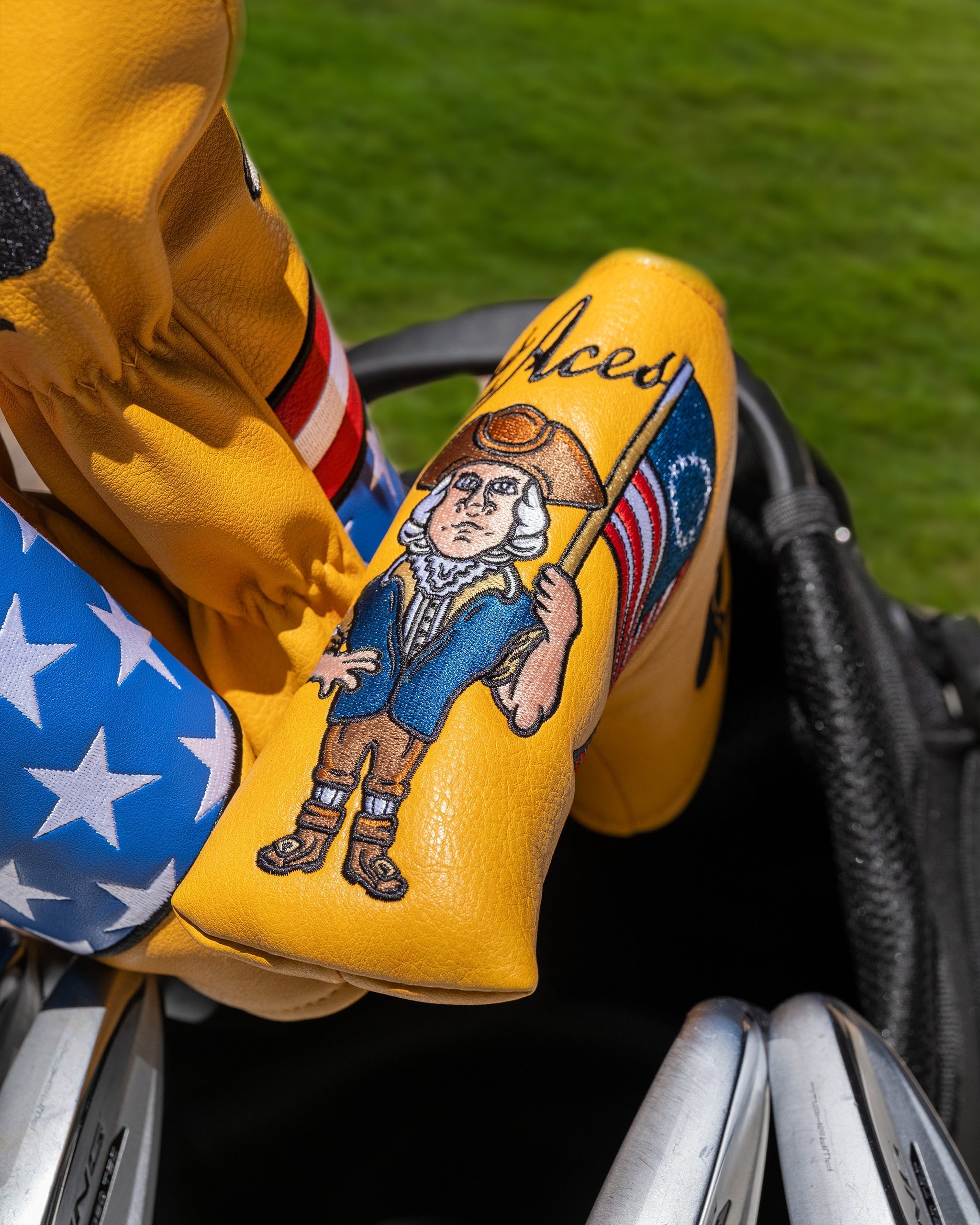 Patriot Blade Putter Cover featuring a patriotic design with a character holding a flag, perfect for bold golfers.