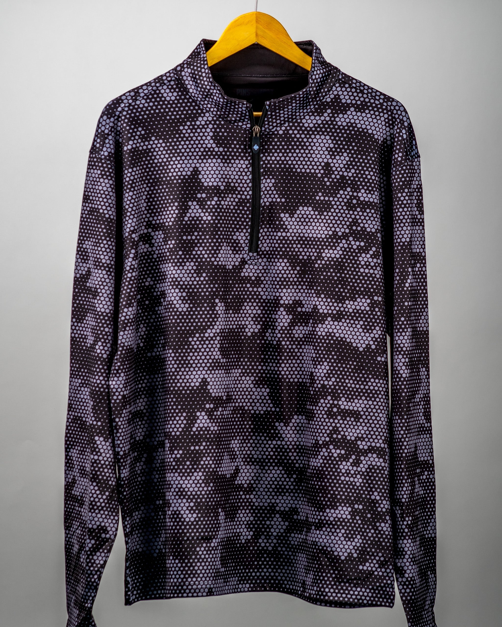 Black Hex Digi Pullover featuring a stylish digital camo pattern and a quarter zip, perfect for golfers seeking a bold look.