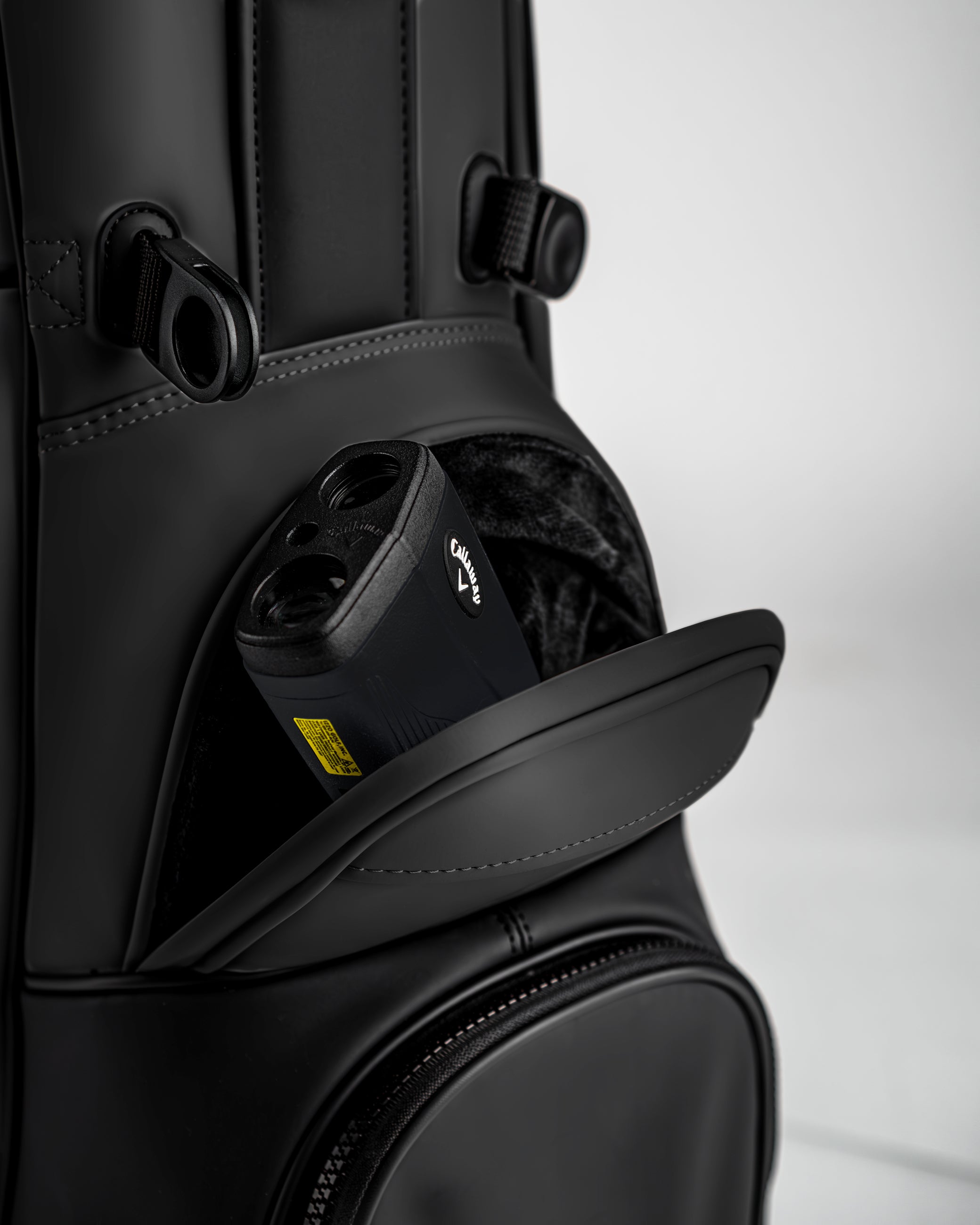 Close-up of the Player Preferred Golf Bag in Obsidian, featuring a pocket with a golf rangefinder inside.