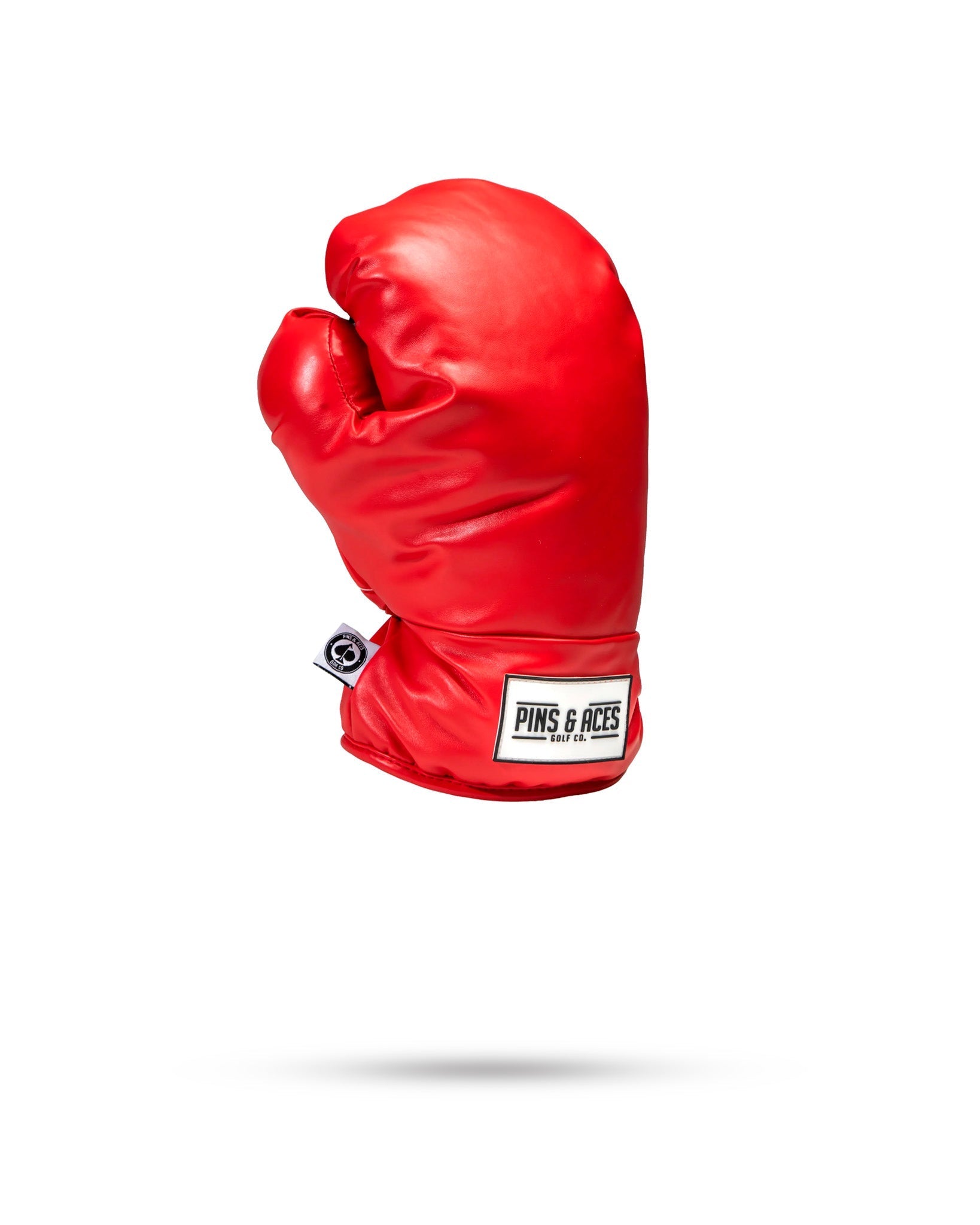 Red boxing glove-shaped fairway cover for golf clubs.