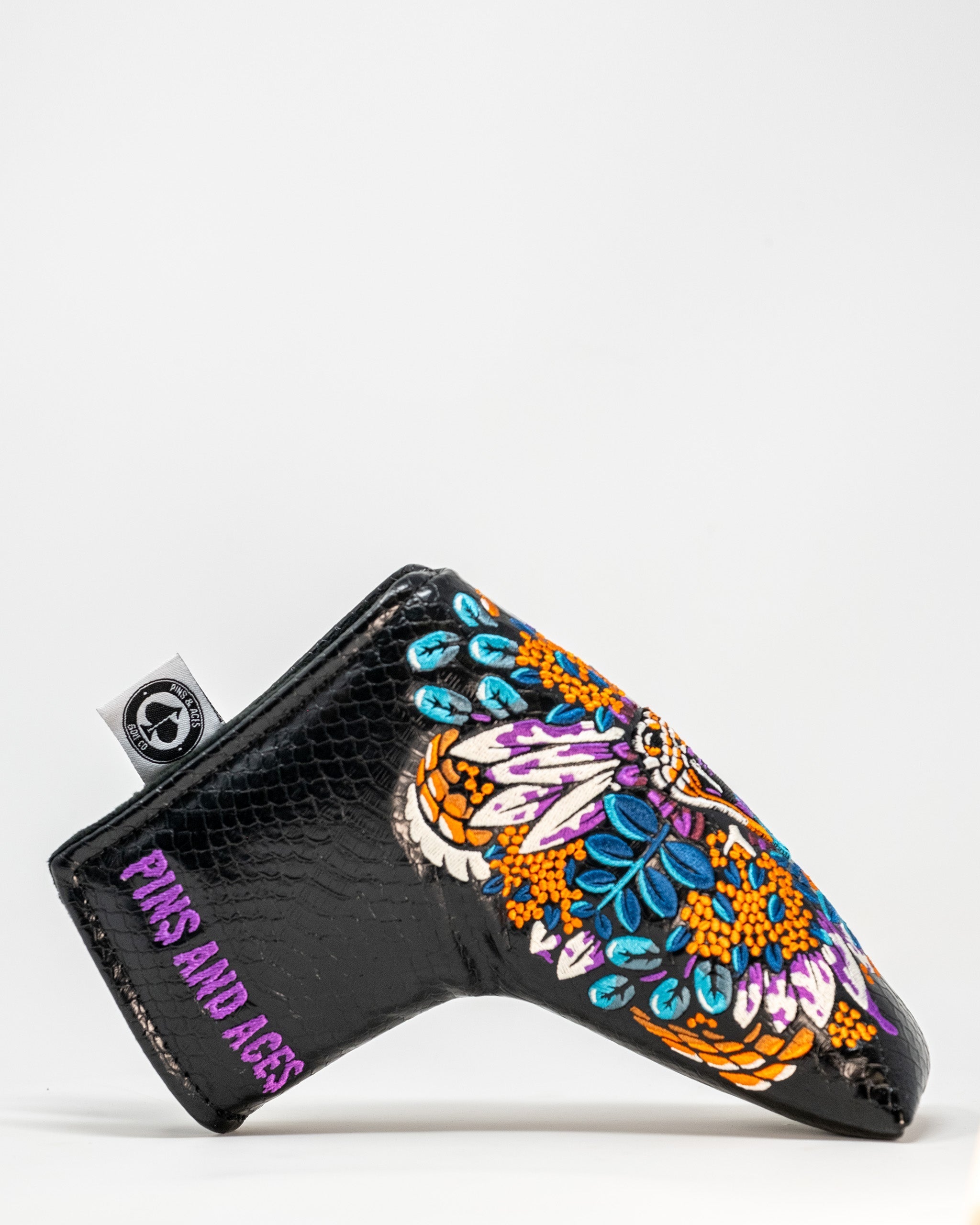 Bold Venom Blade Putter Cover featuring vibrant floral designs and a sleek black finish, perfect for stylish golfers.