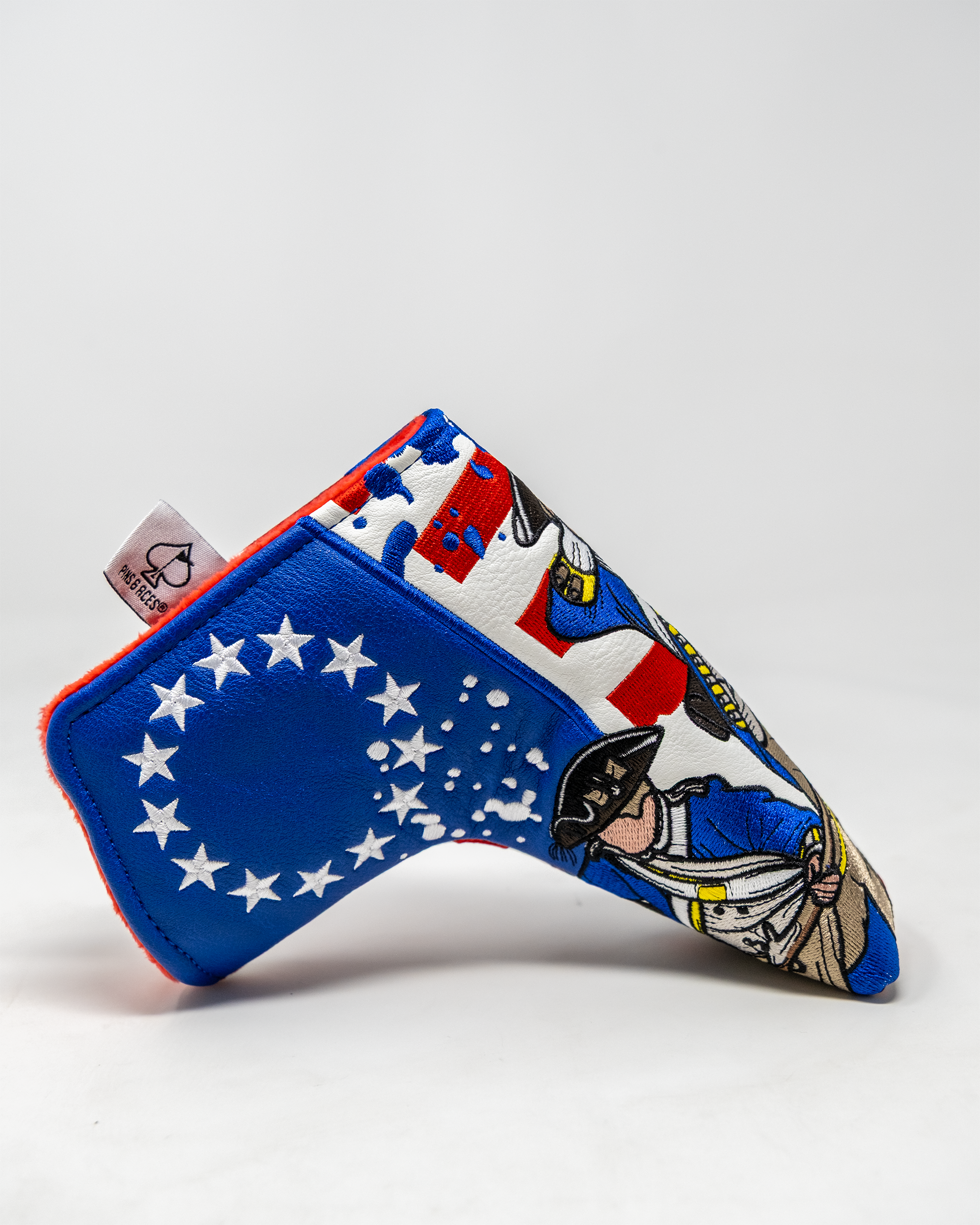 Colorful Blade Putter Cover featuring patriotic designs, including historical figures and stars on a blue background.