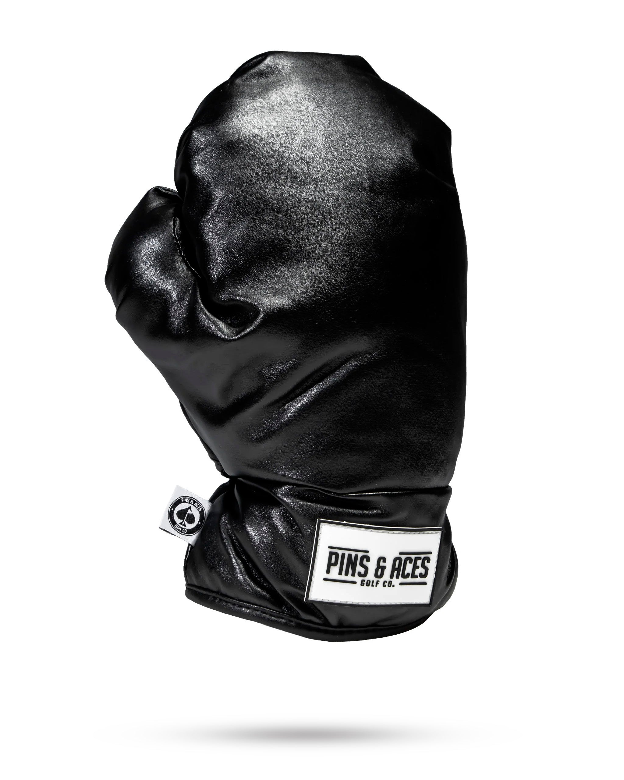 Black boxing glove driver cover, designed for golf club protection with a sleek and sporty appearance.