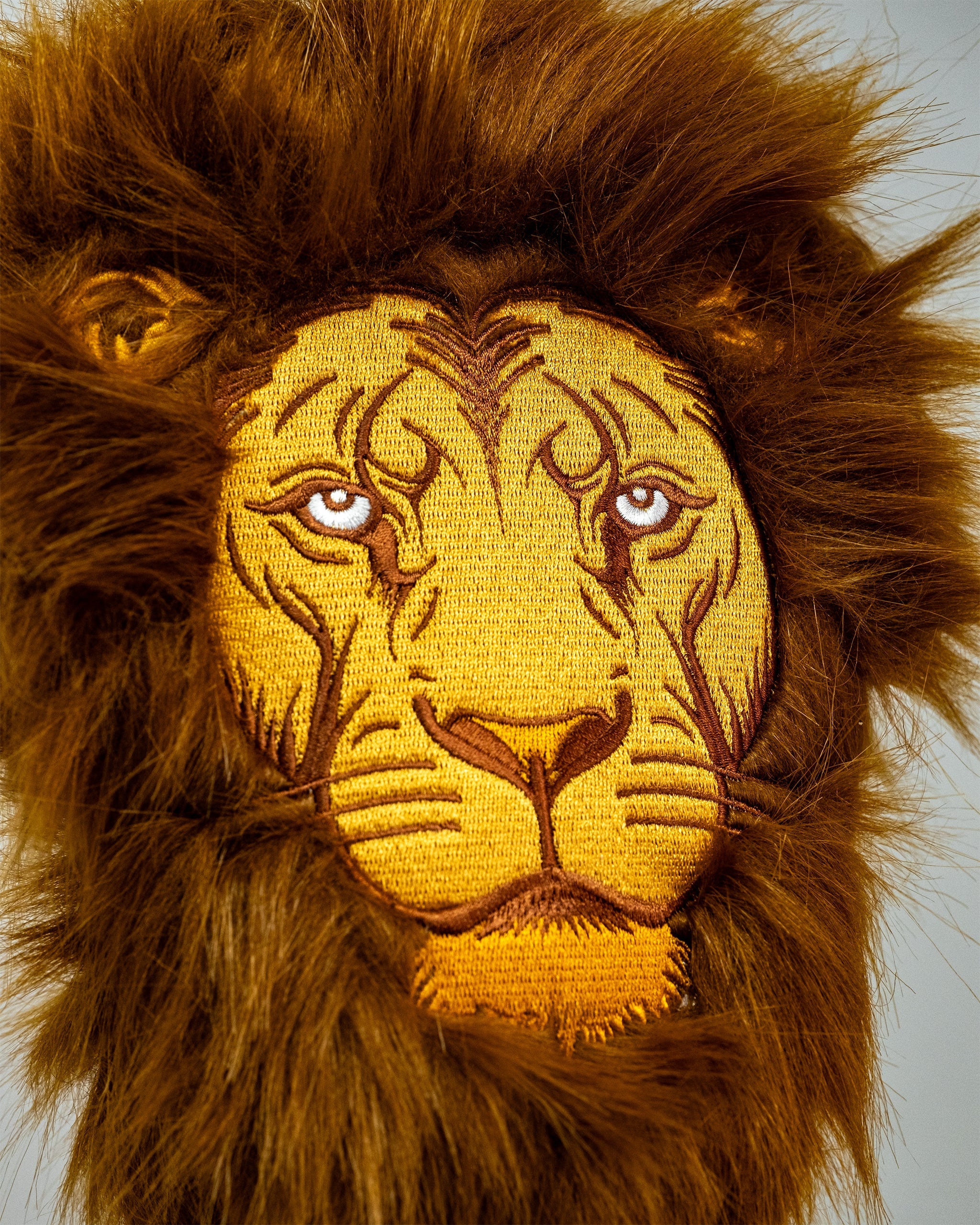 Lion driver cover featuring realistic detailing with a vibrant lion face design, crafted to fit standard golf clubs.