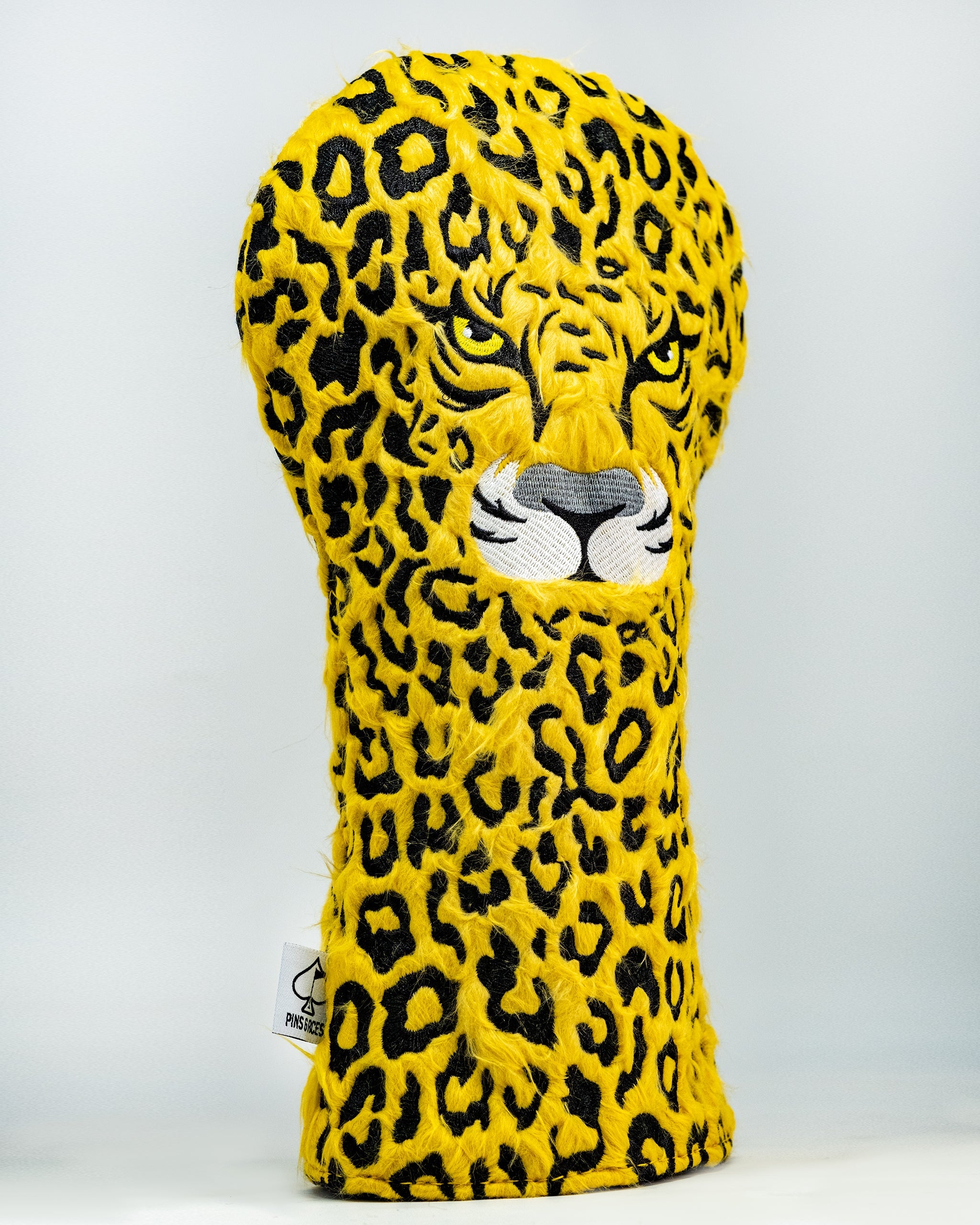 Leopard print golf driver cover with cut-out ears and facial features, designed for style and protection.