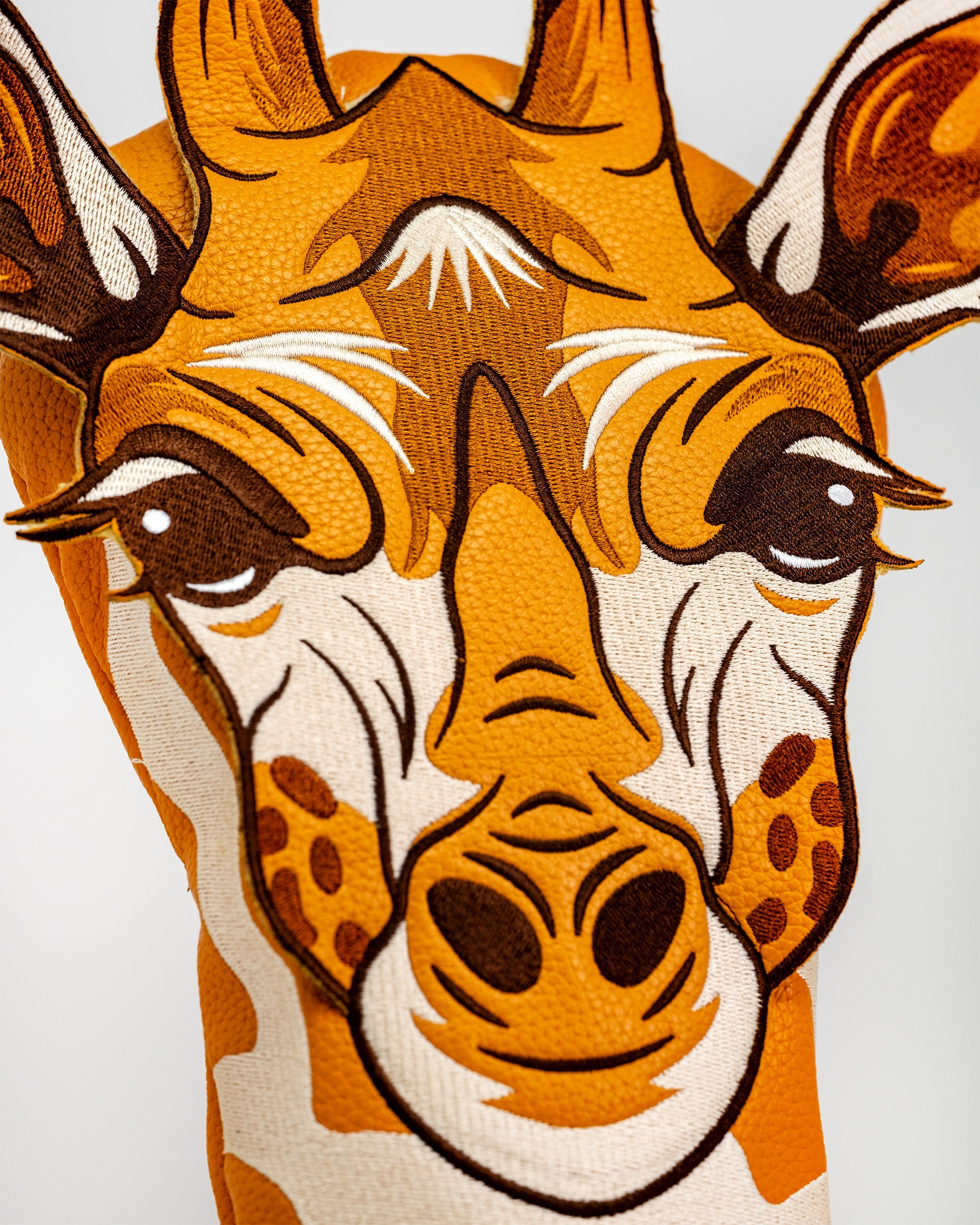 Giraffe golf driver head cover featuring a realistic giraffe design.