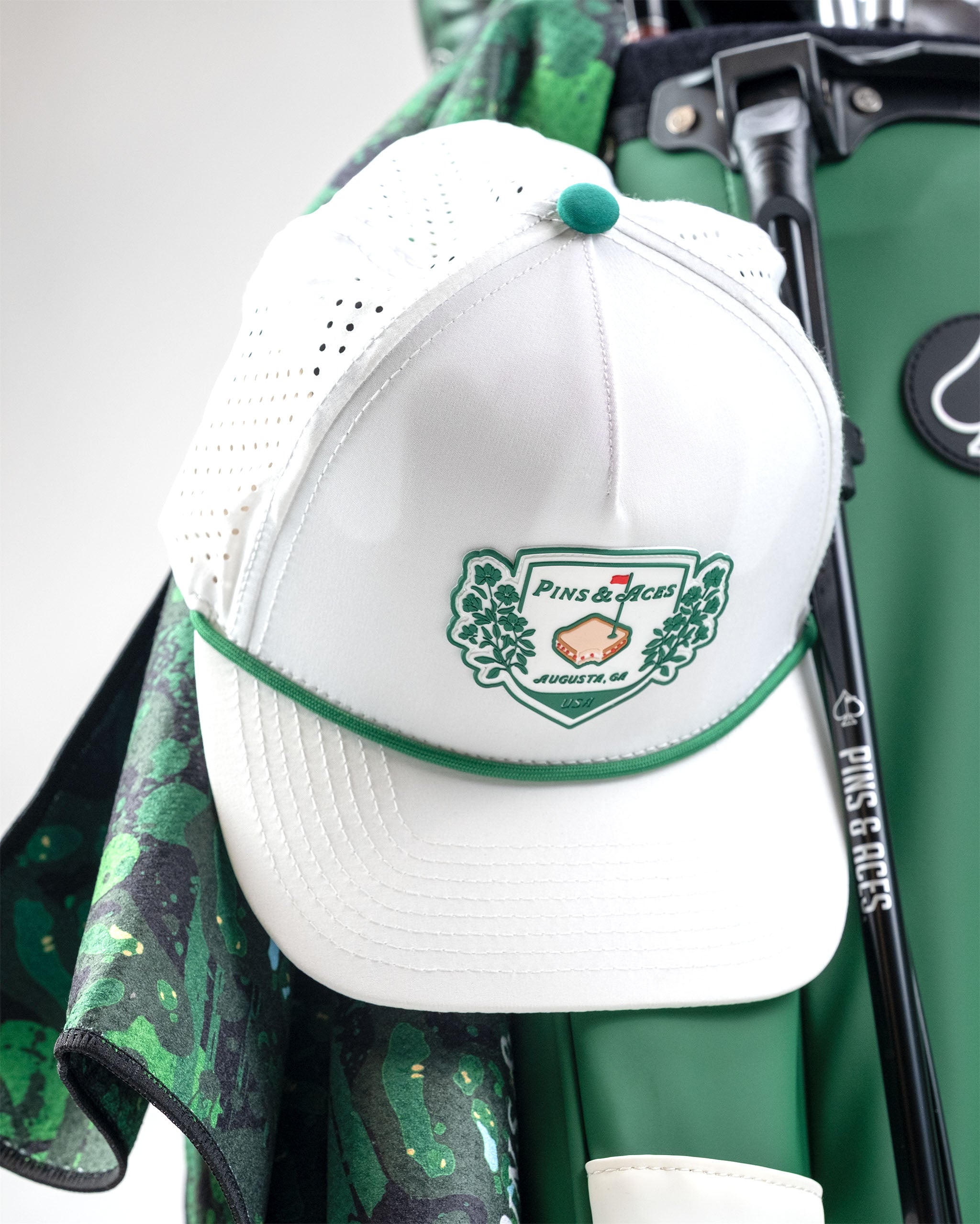 Perforated white rope hat by Pimento Crest featuring a stylish design and ventilation holes.