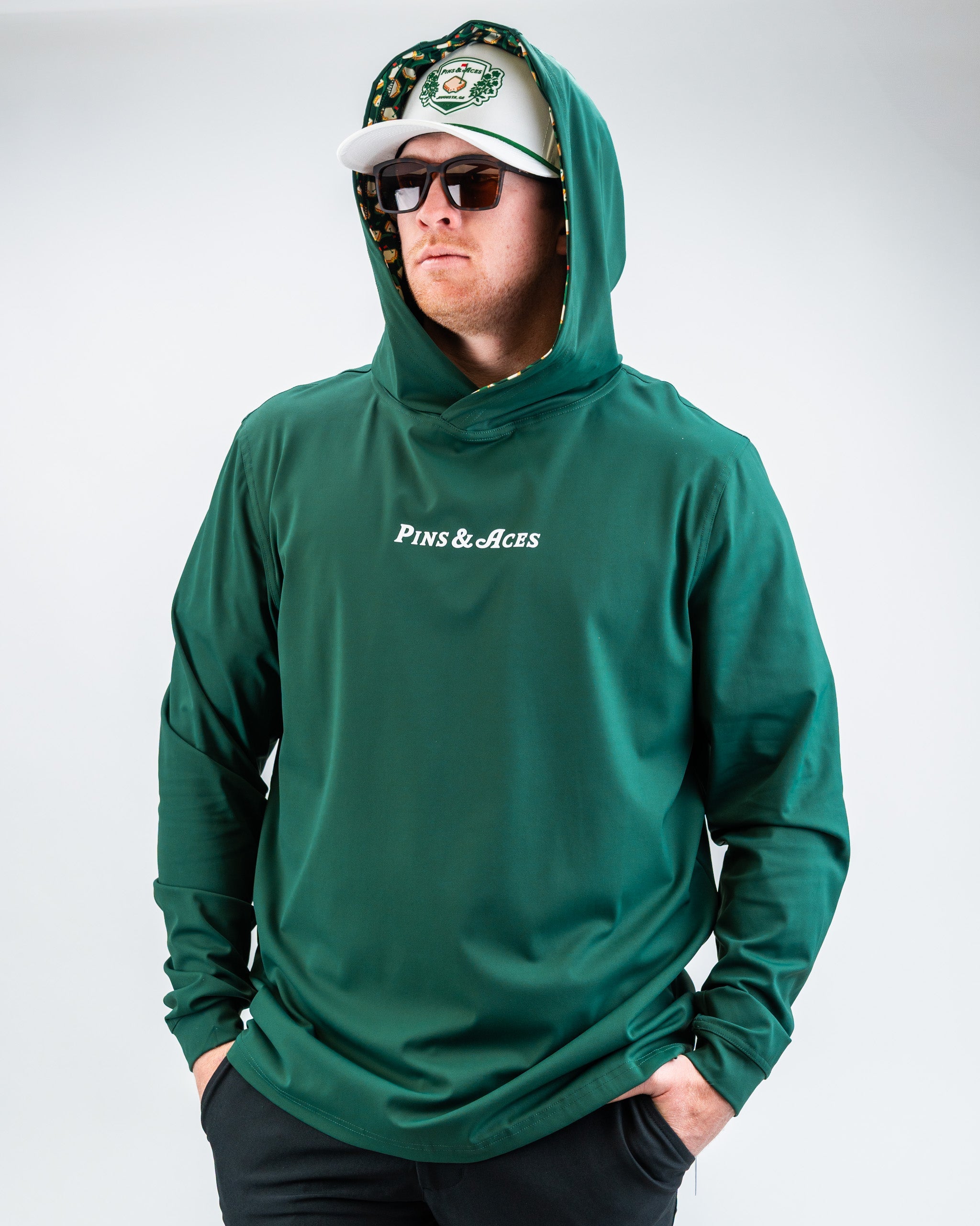 Performance Golf Hoodie in Pimento 4.0, featuring a vibrant red color, lightweight fabric, and a stylish design suitable for golfers.