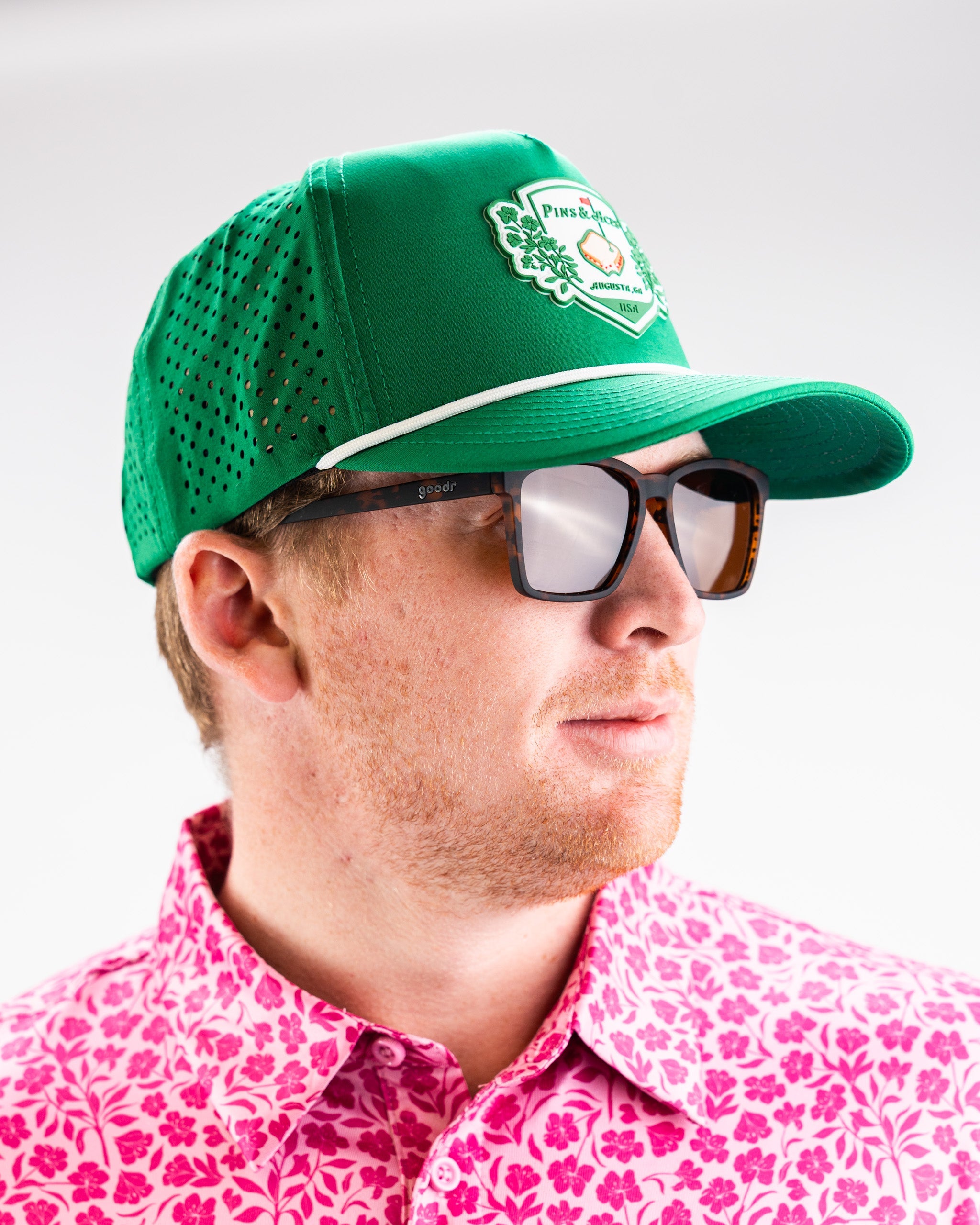 Green perforated rope hat from Pimento Crest with a stylish design.