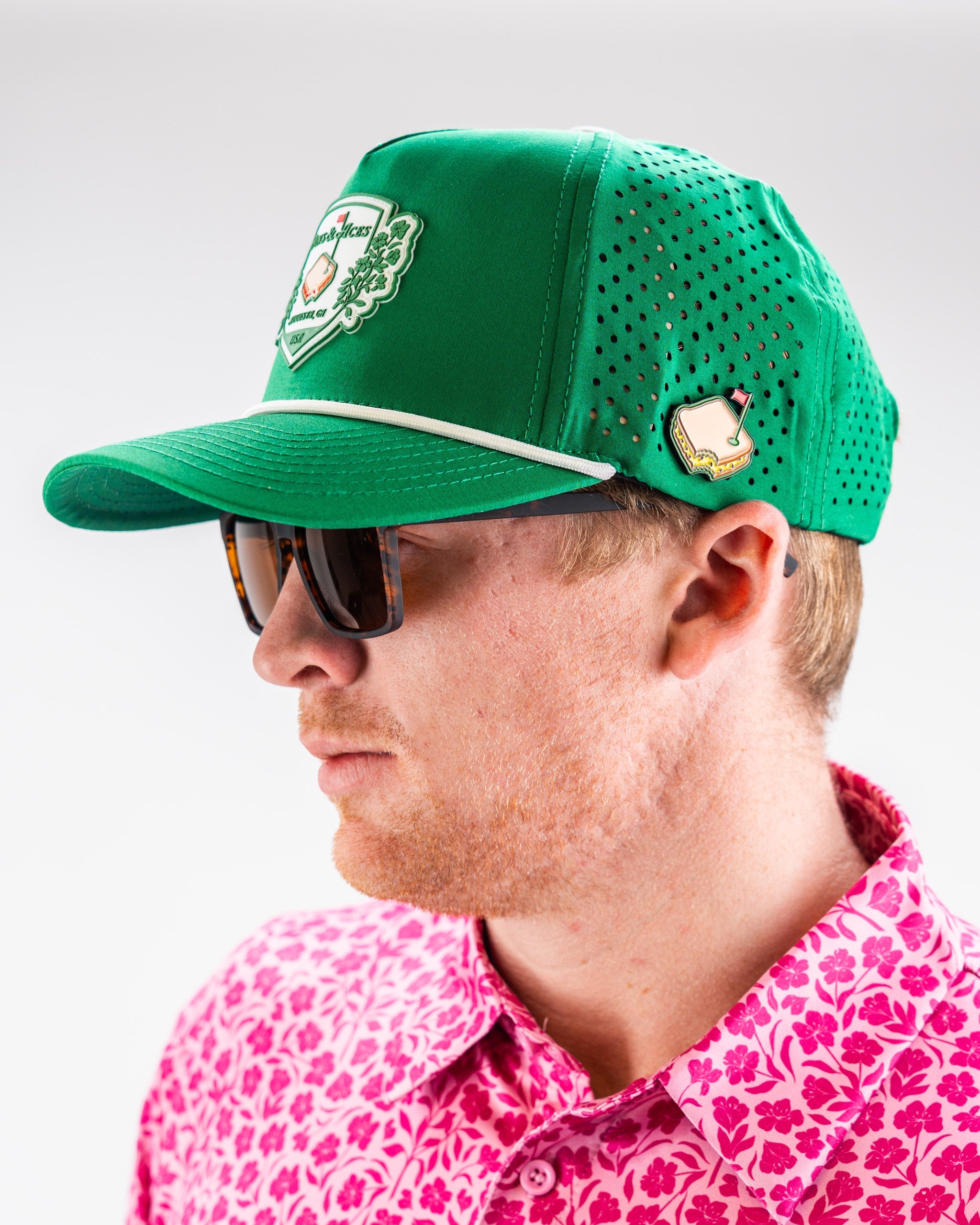 Green perforated rope hat from Pimento Crest, featuring a stylish design and adjustable fit.