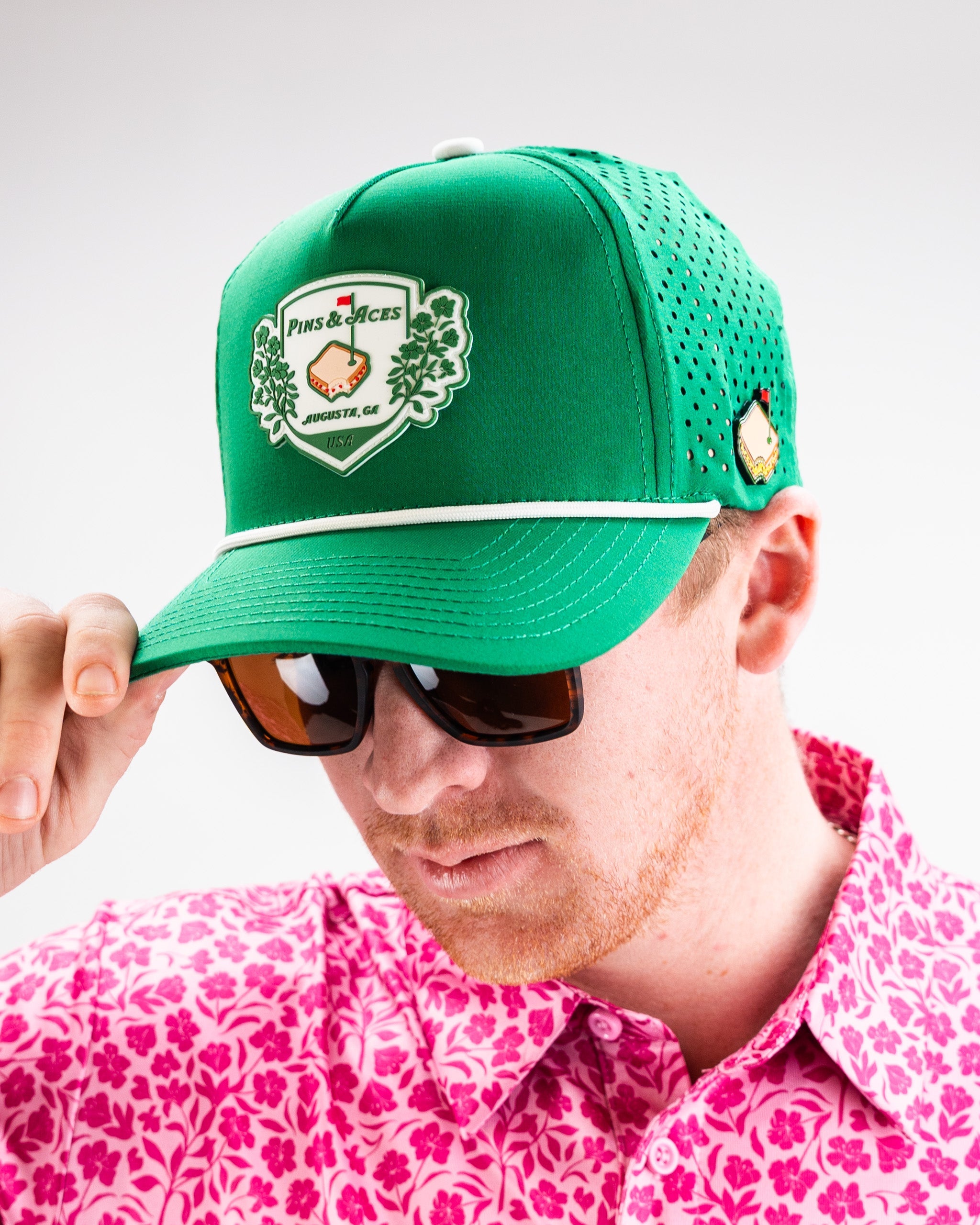 Green perforated rope hat by Pimento Crest, featuring a casual design ideal for outdoor activities.