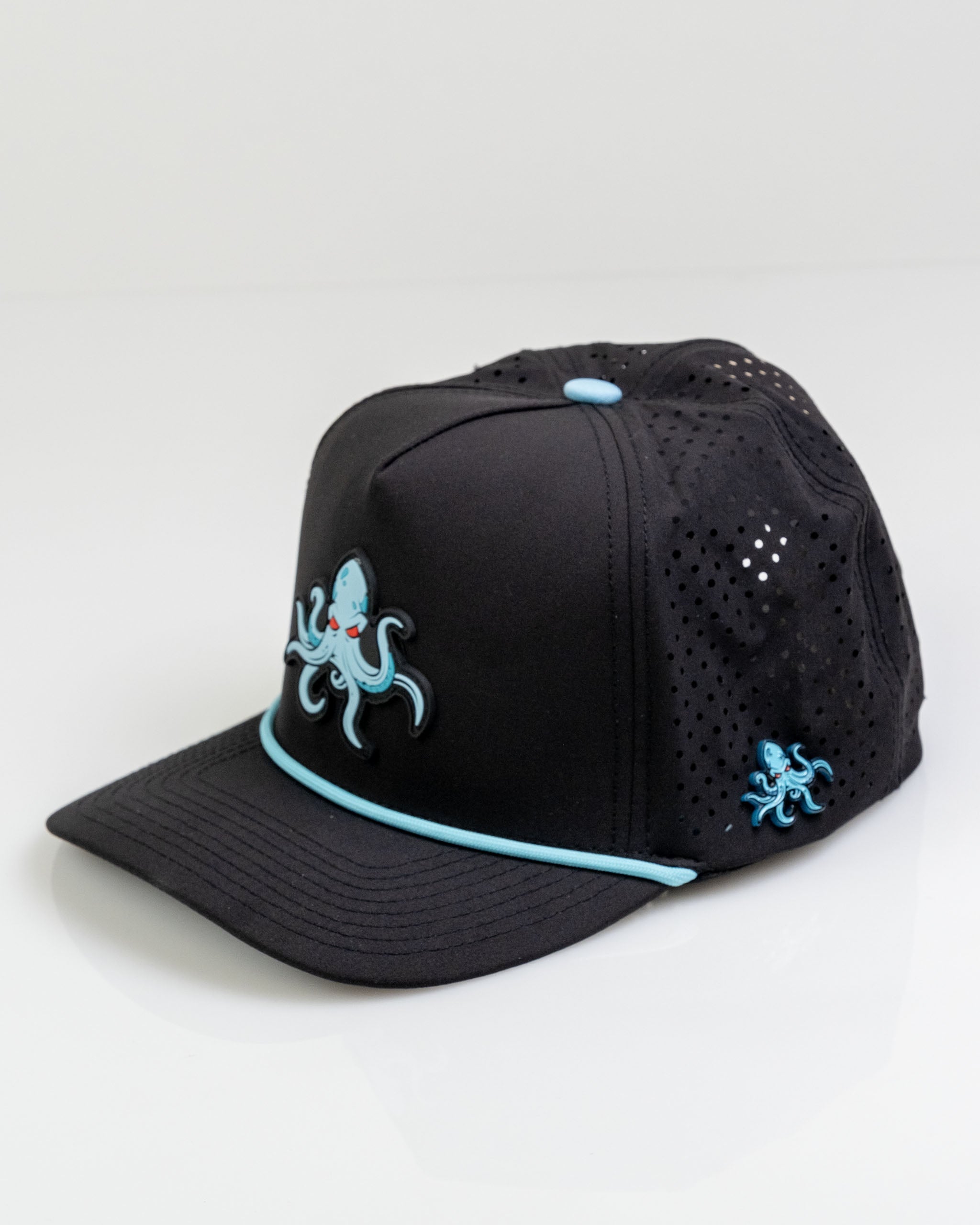 Kraken Black perforated rope hat featuring a blue octopus design and a stylish flat brim for golfers.
