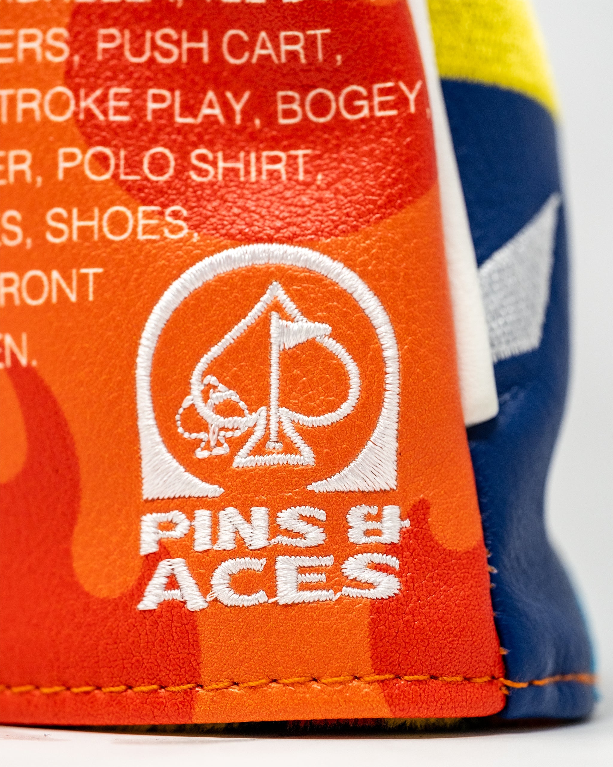 Hot sauce-themed fairway golf club cover featuring a vibrant red and yellow design with taco and chili graphics.