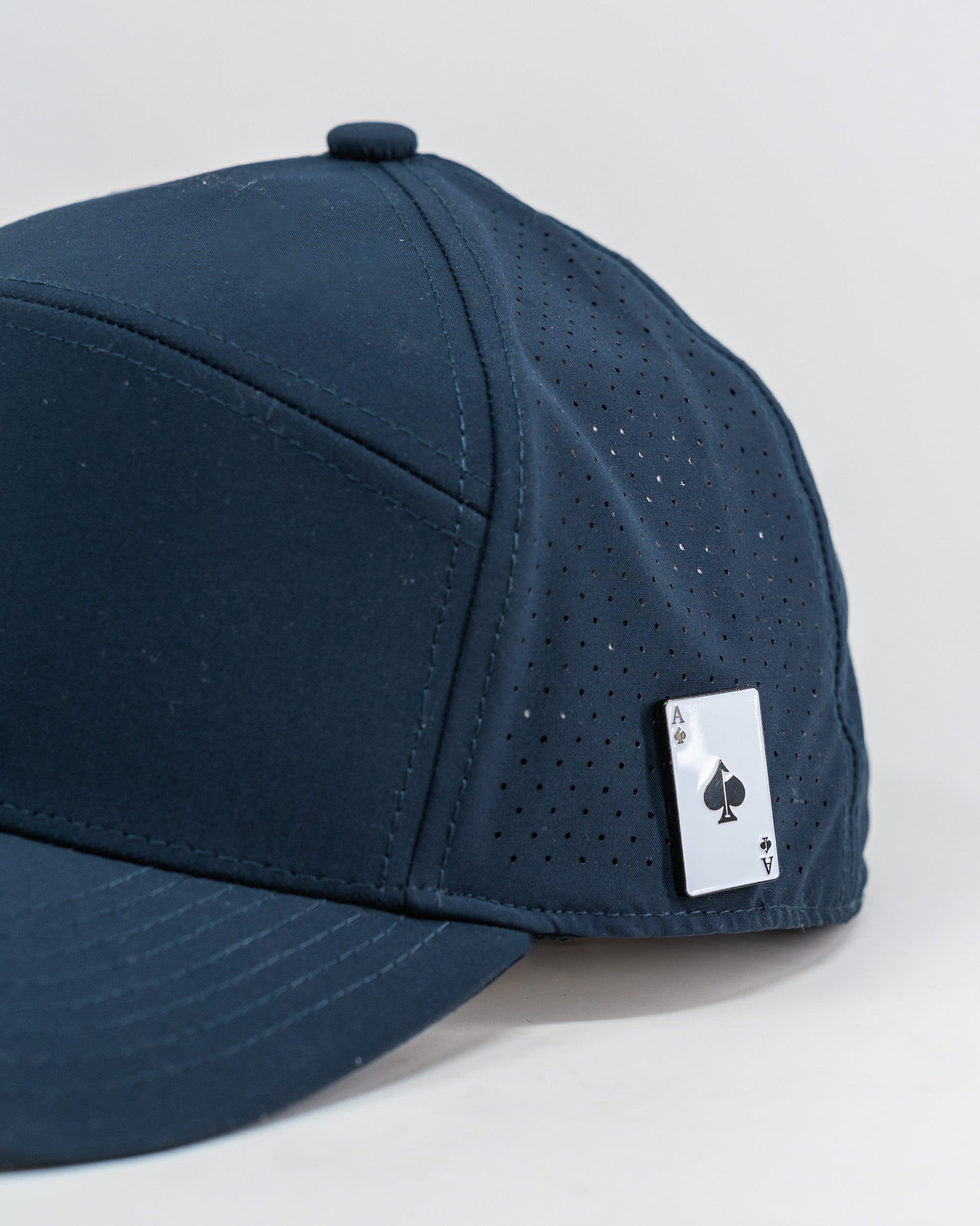 Navy Tradesman Hat featuring a structured design and adjustable strap.