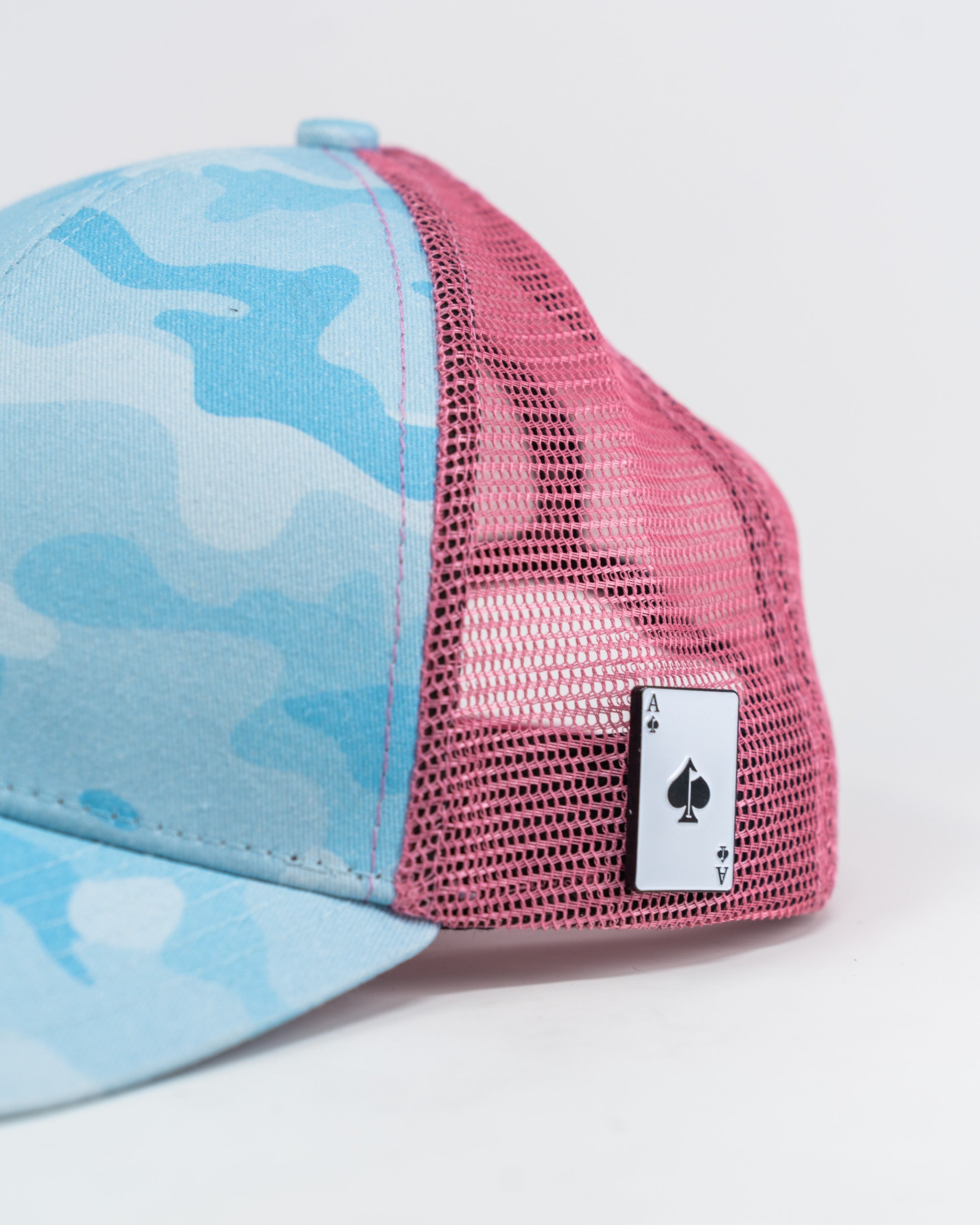 Cotton Candy Camo trucker hat featuring a pastel camo pattern and breathable mesh back, ideal for casual outdoor wear.