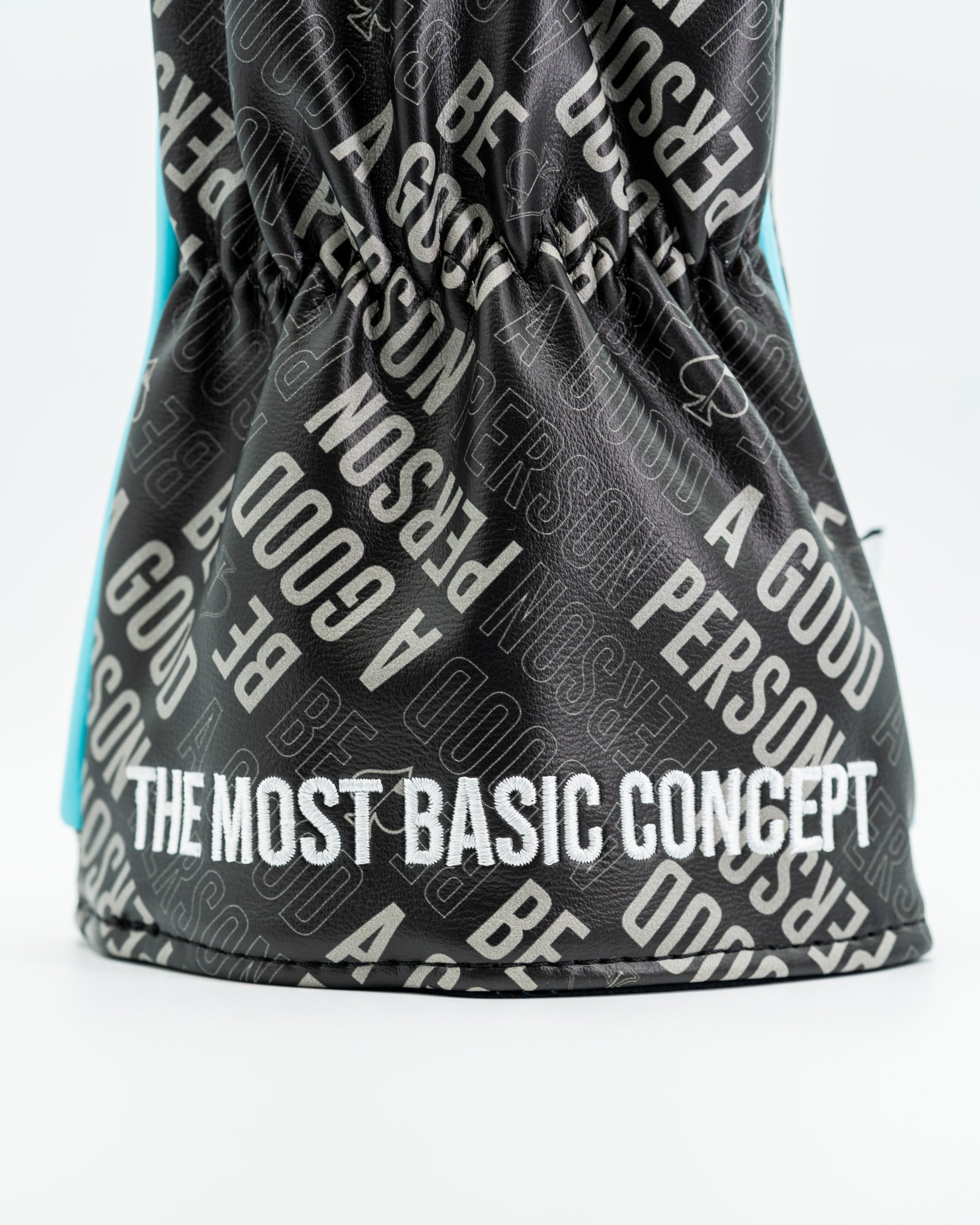 Black driver cover featuring bold text that reads "Be A Good Person" and "The Most Basic Concept" in a stylish design.