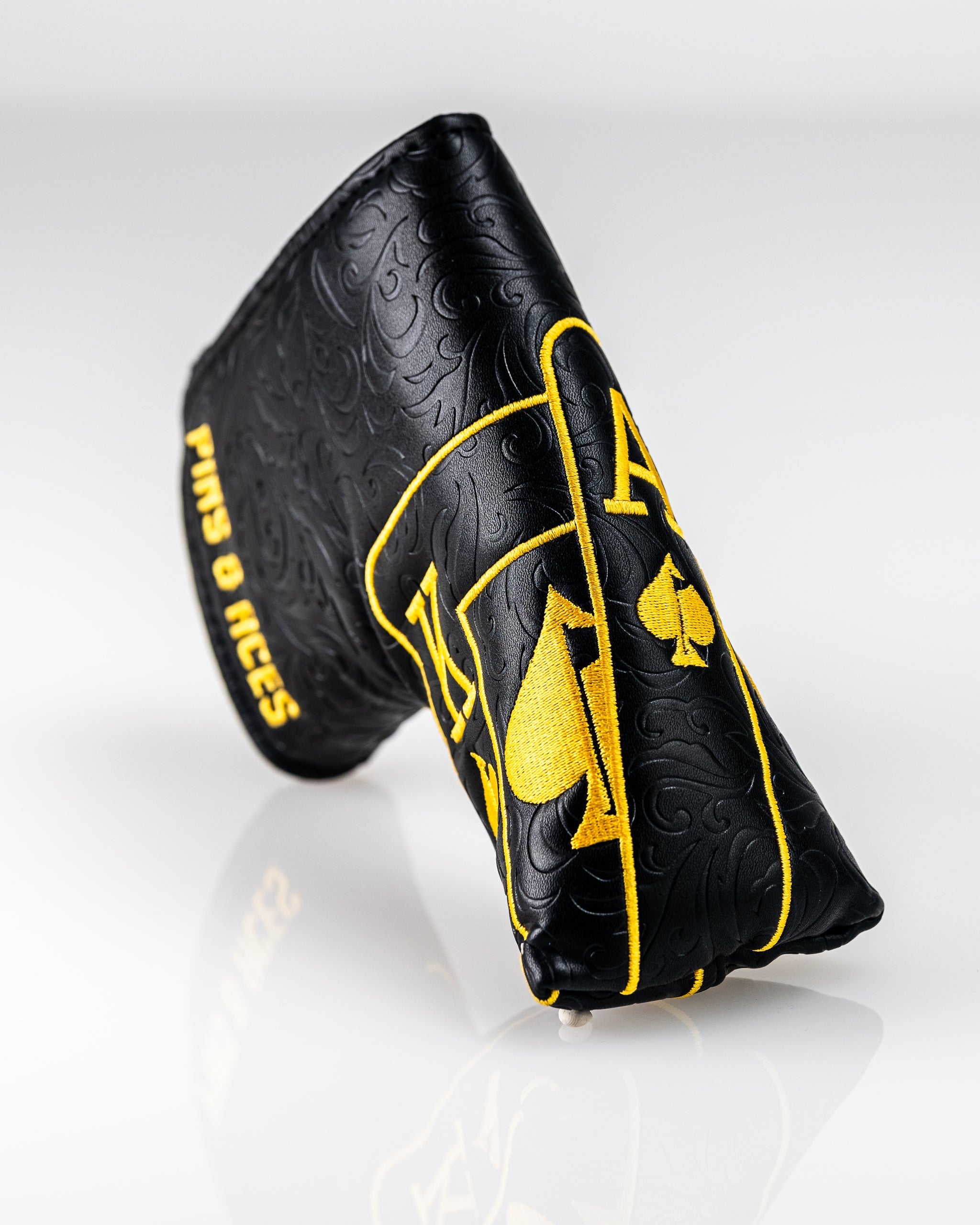 Black and gold Ace of Spades blade putter cover featuring a sleek design with a spade emblem, perfect for protecting your putter in style.