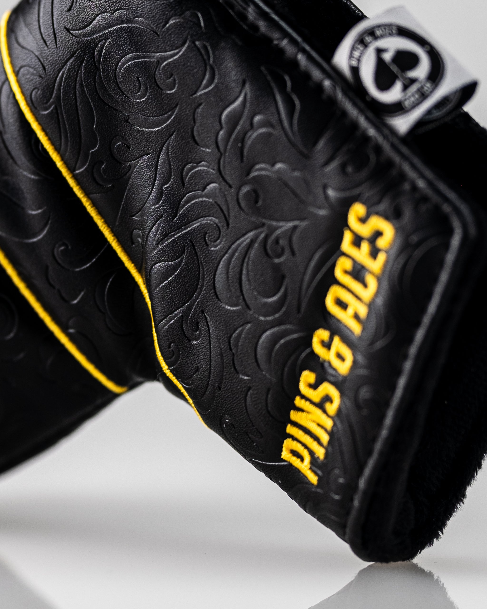 Black and gold Ace of Spades blade putter cover featuring a sleek design and durable material.