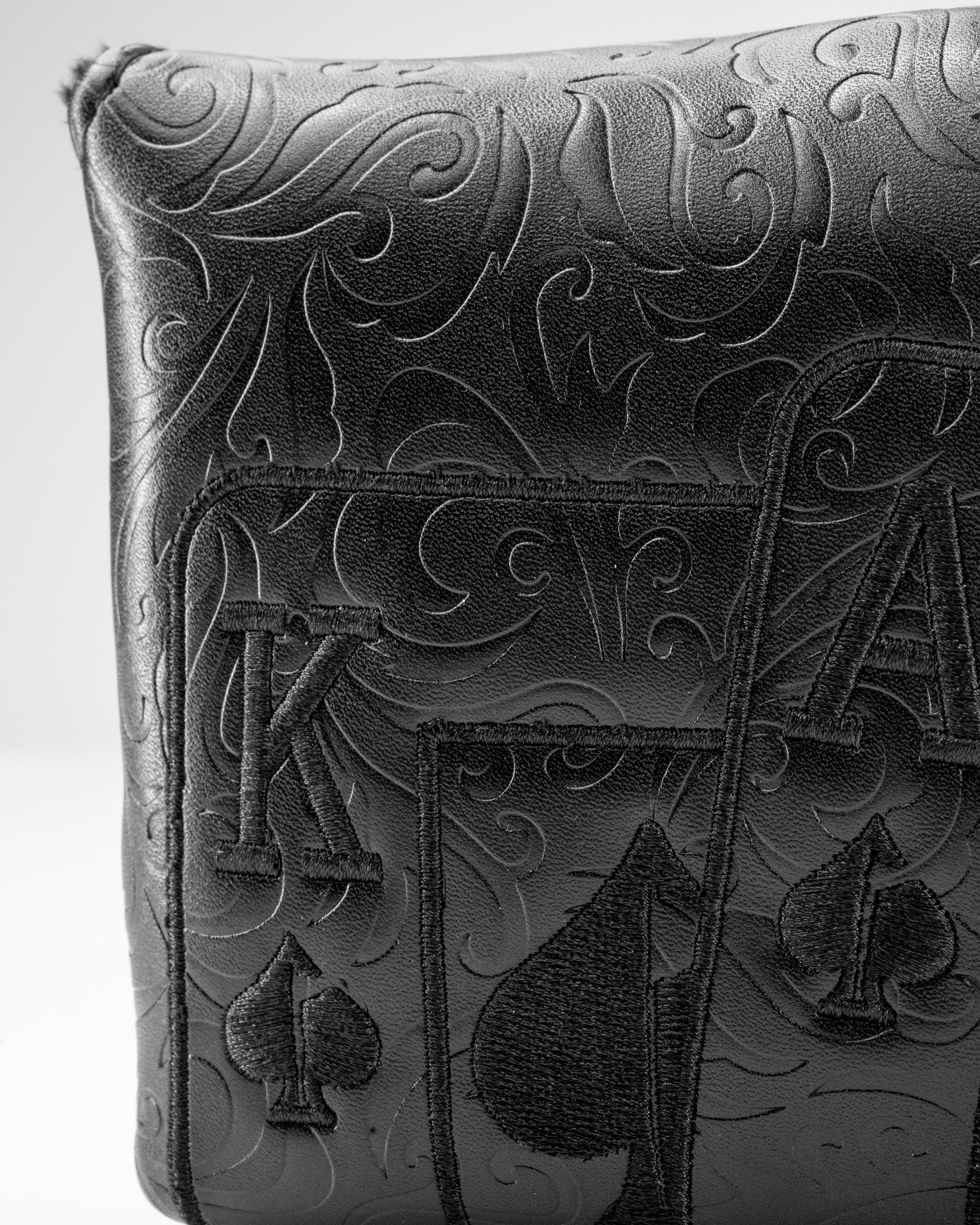Blackout Ace of Spades center shaft mallet putter cover featuring intricate embossed designs and a sleek black finish.