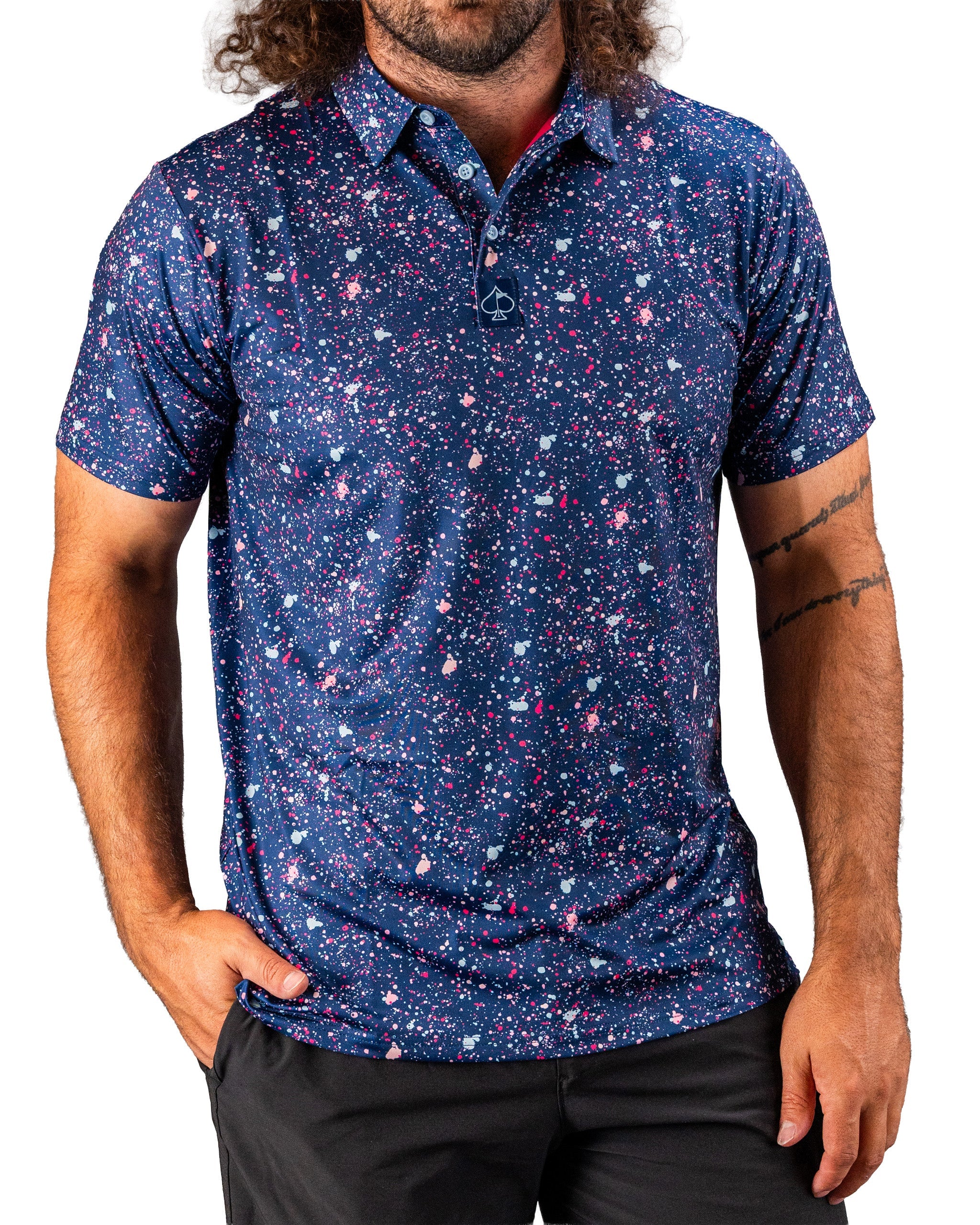 Men's blue splatter golf polo featuring a vibrant, colorful design, perfect for making a bold statement on the course.