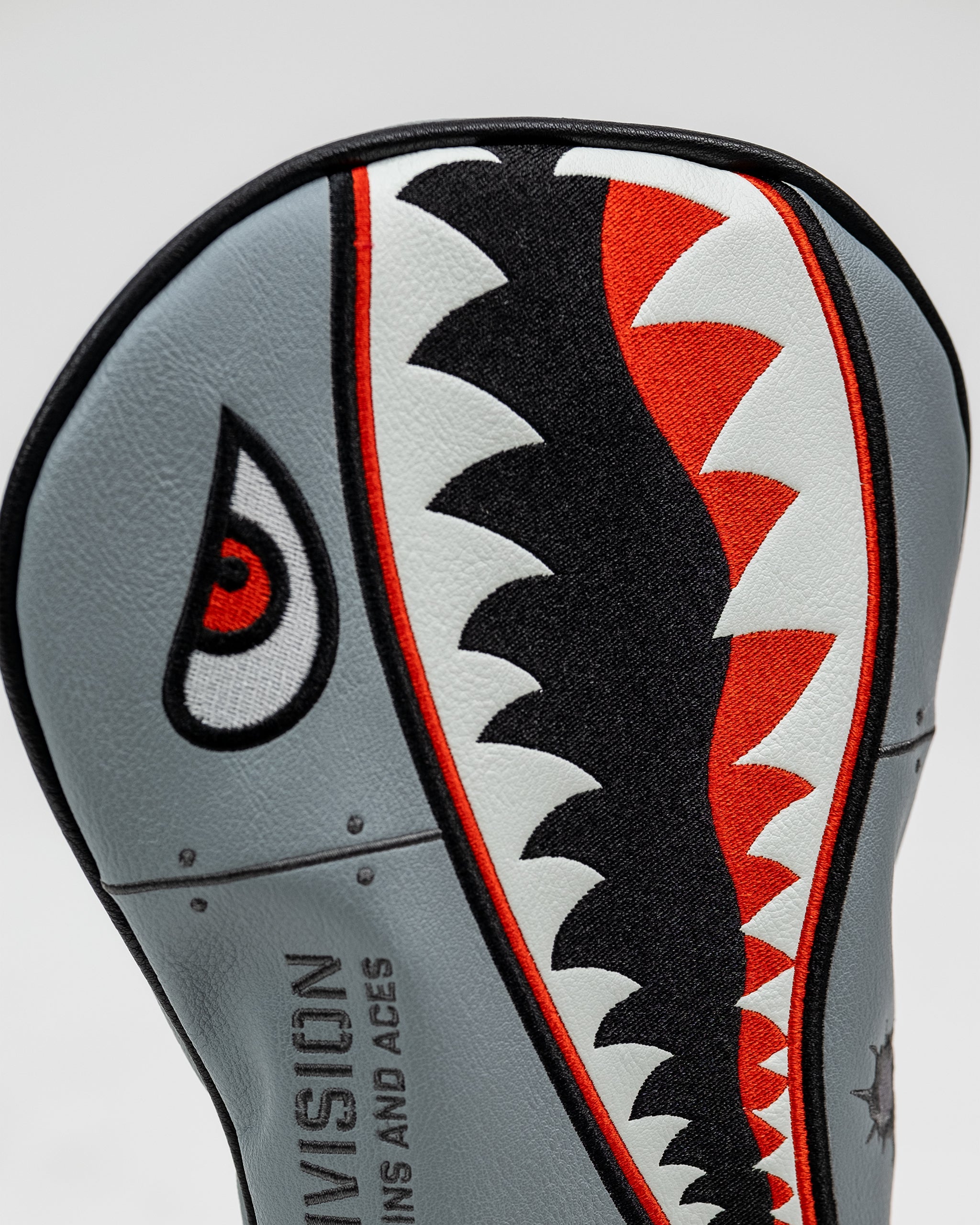 Bomber driver cover featuring a vibrant design and durable material, designed to protect golf club heads.