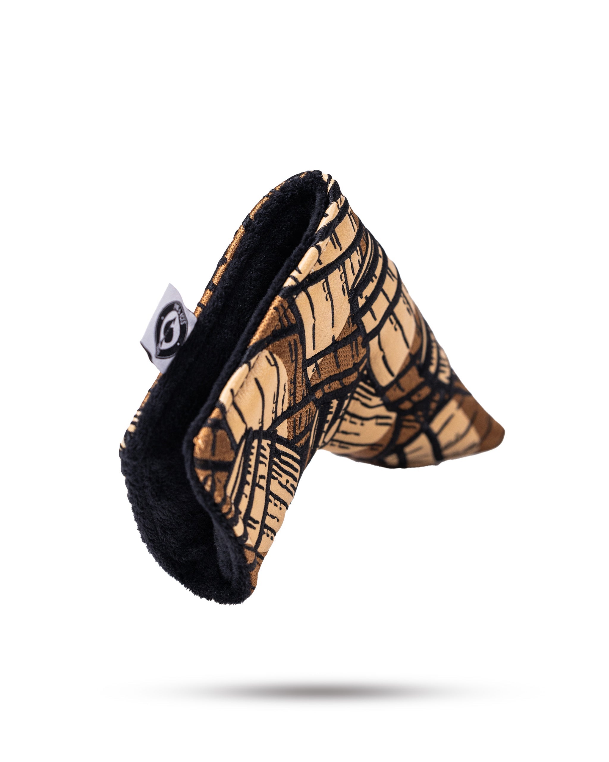 Bourbon Barrel Blade Putter Cover featuring a textured leather design with stitched accents, ideal for protecting and personalizing golf putters.