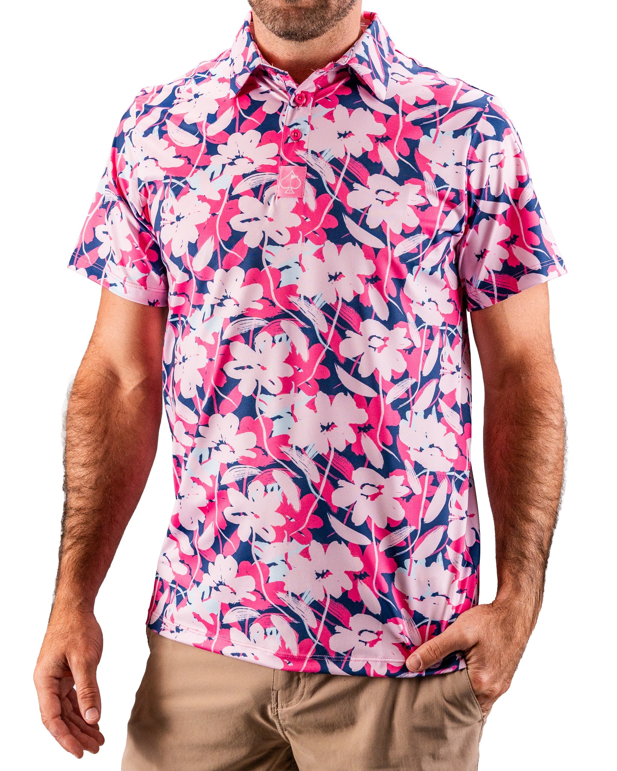 Men's pink and navy floral golf shirt with short sleeves, button-up front, and bold, tropical print for standout style.