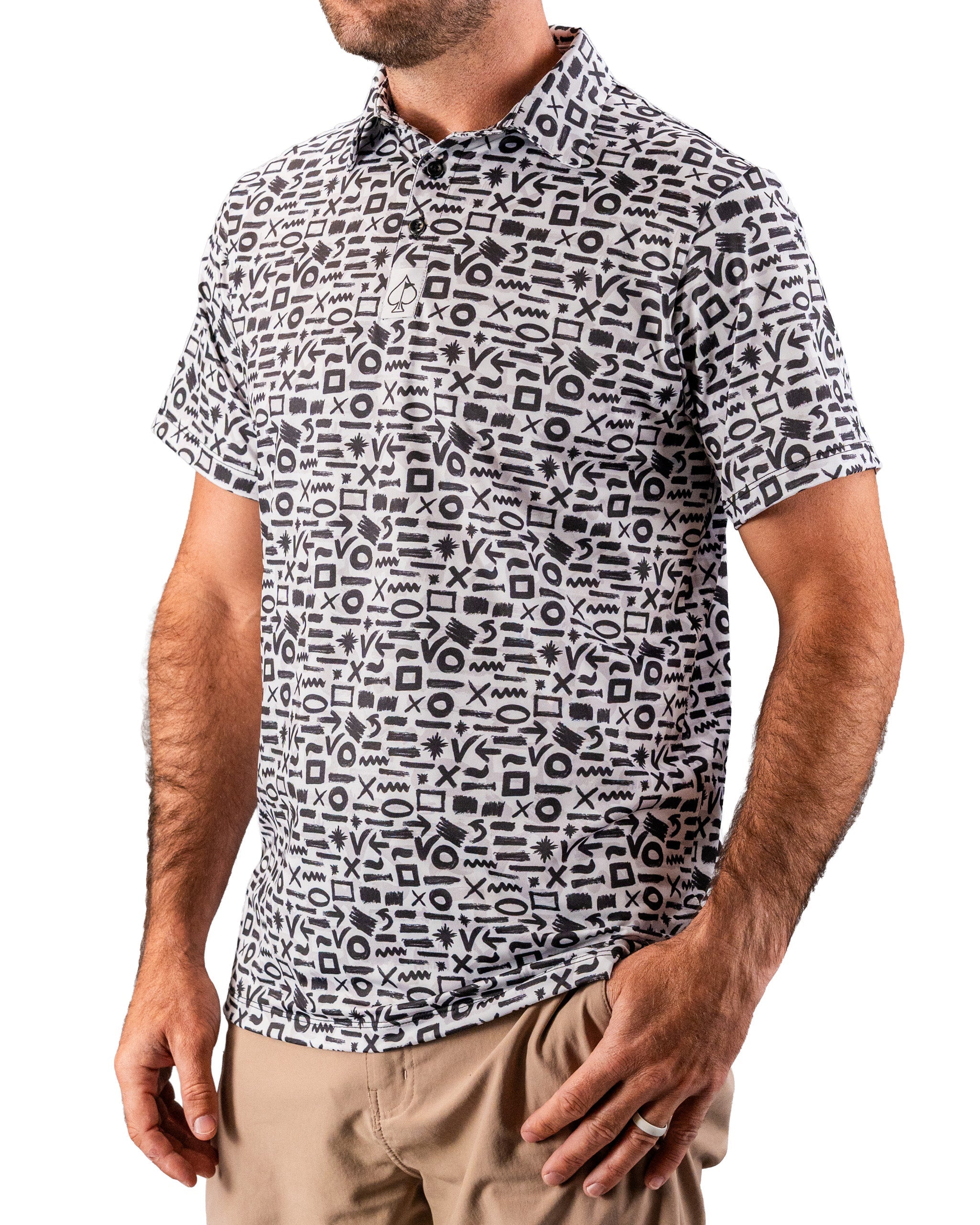 Men's black and white patterned golf polo shirt with abstract geometric print, short sleeves, and classic collar.