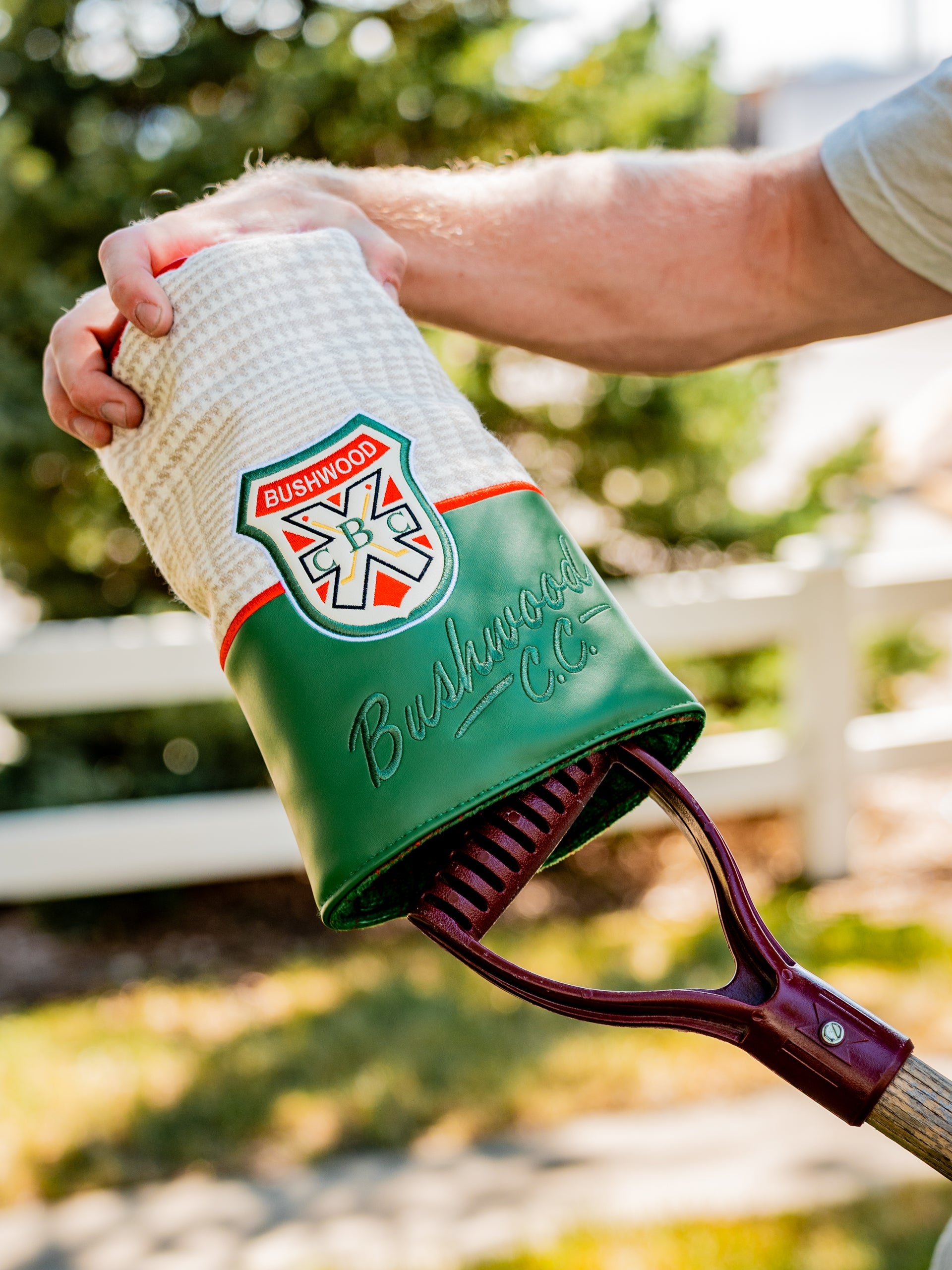 Stylish Bushwood CC driver cover featuring a green and white design, perfect for golfers wanting to stand out on the course.