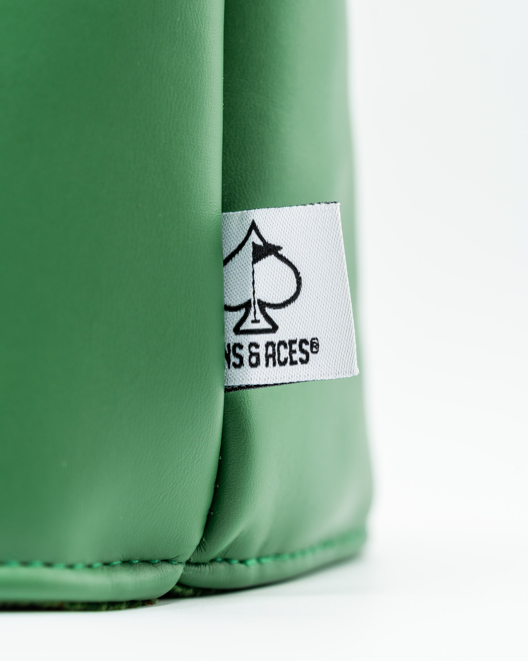 Bushwood Country Club driver cover in green with a sleek design and Pins & Aces logo for stylish golf protection.