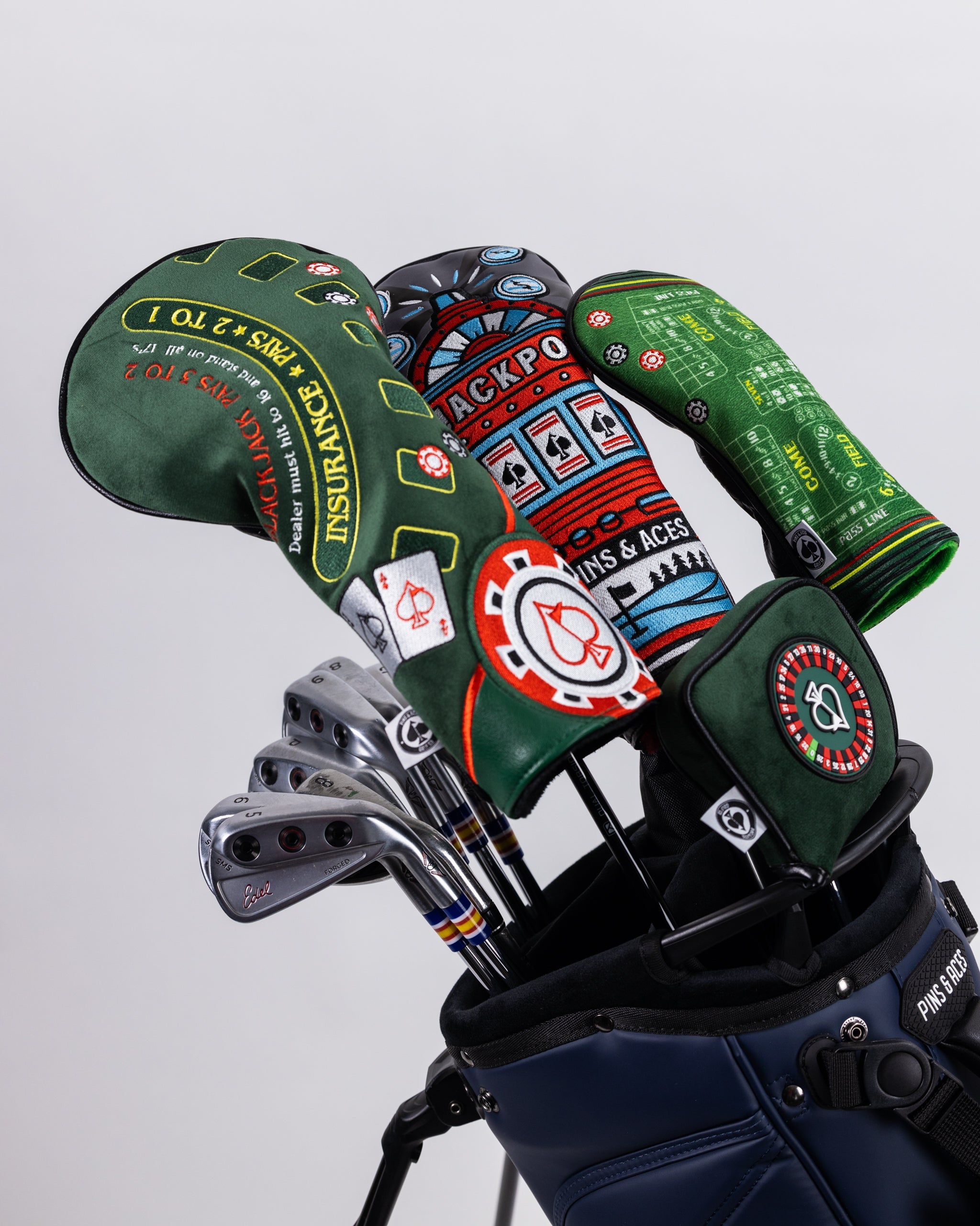 Roulette-themed mallet putter cover featuring a vibrant casino design with a circular roulette wheel motif.