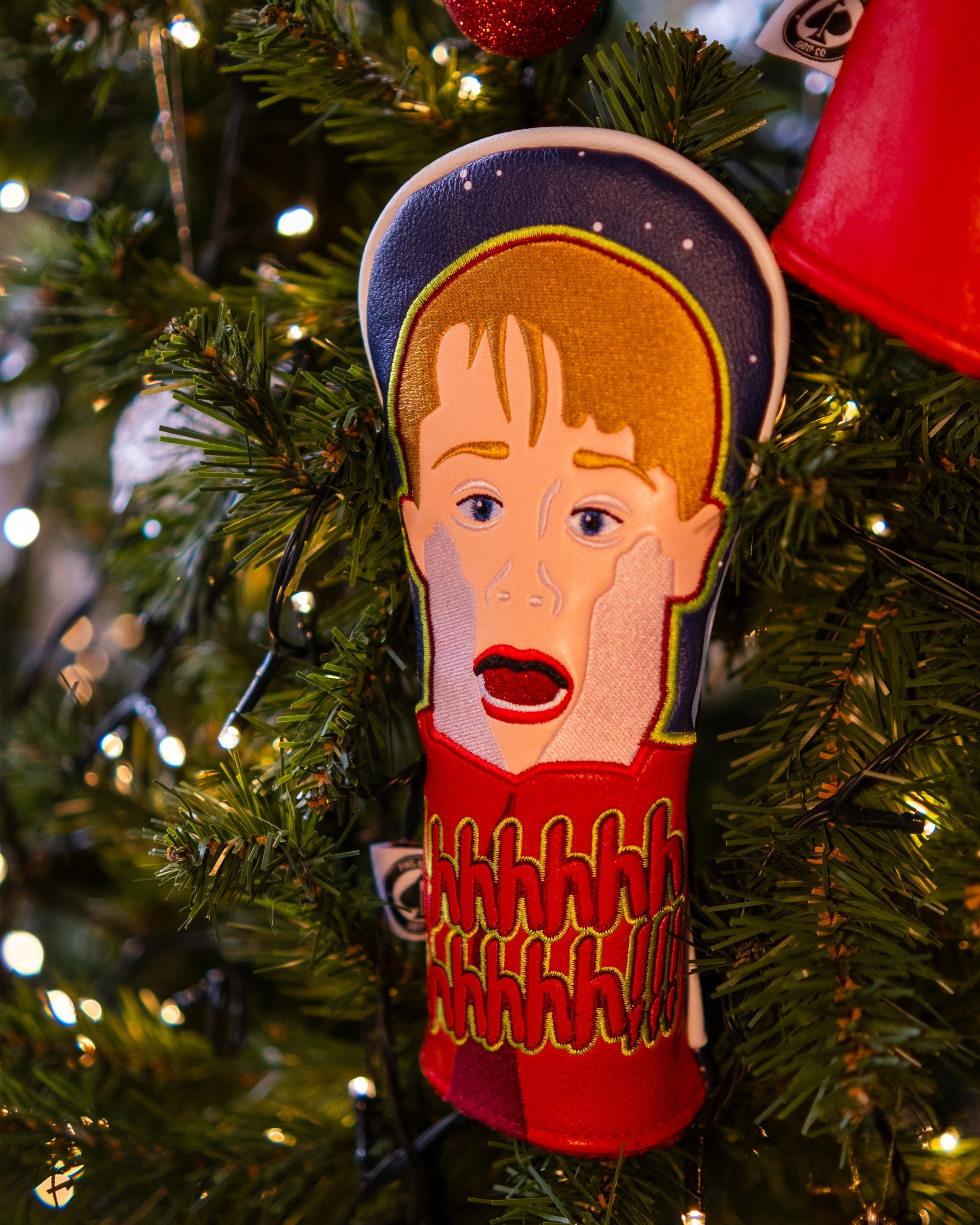 Screaming Rescue Cover with vibrant red color and white graphic design featuring a stylized Christmas tree.