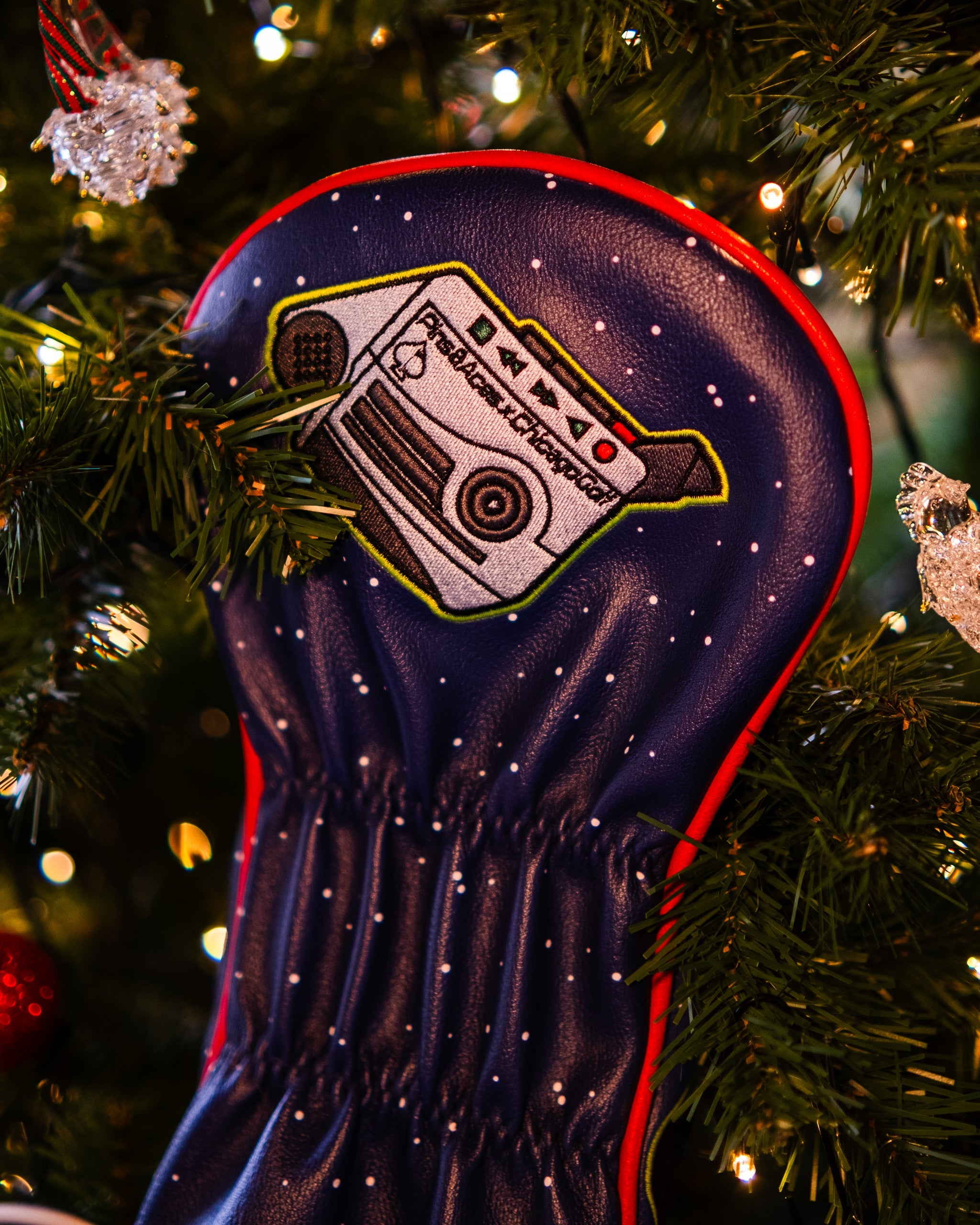 Filthy Animals Driver Cover featuring festive holiday design with a Christmas tree on a dark background.