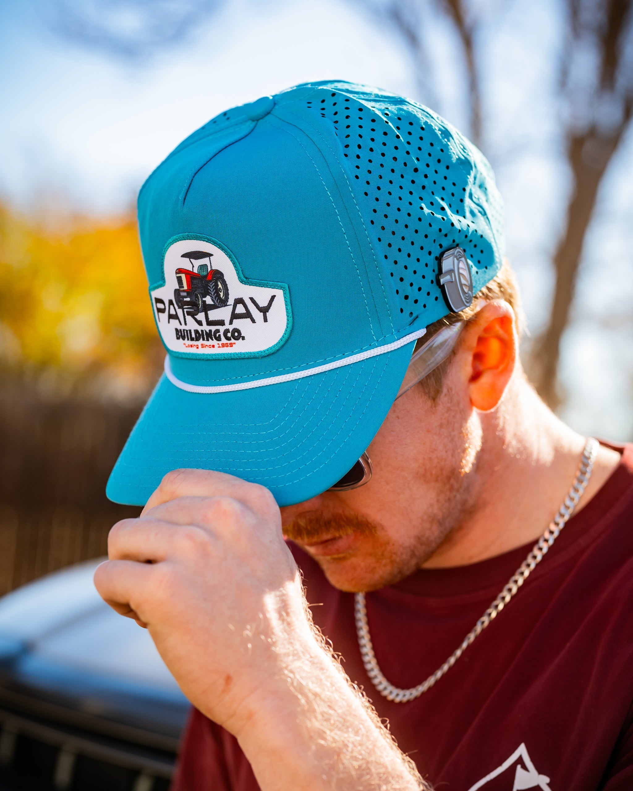 Perforated baby blue rope hat by Parlay Building Co. with a stylish design and adjustable fit.