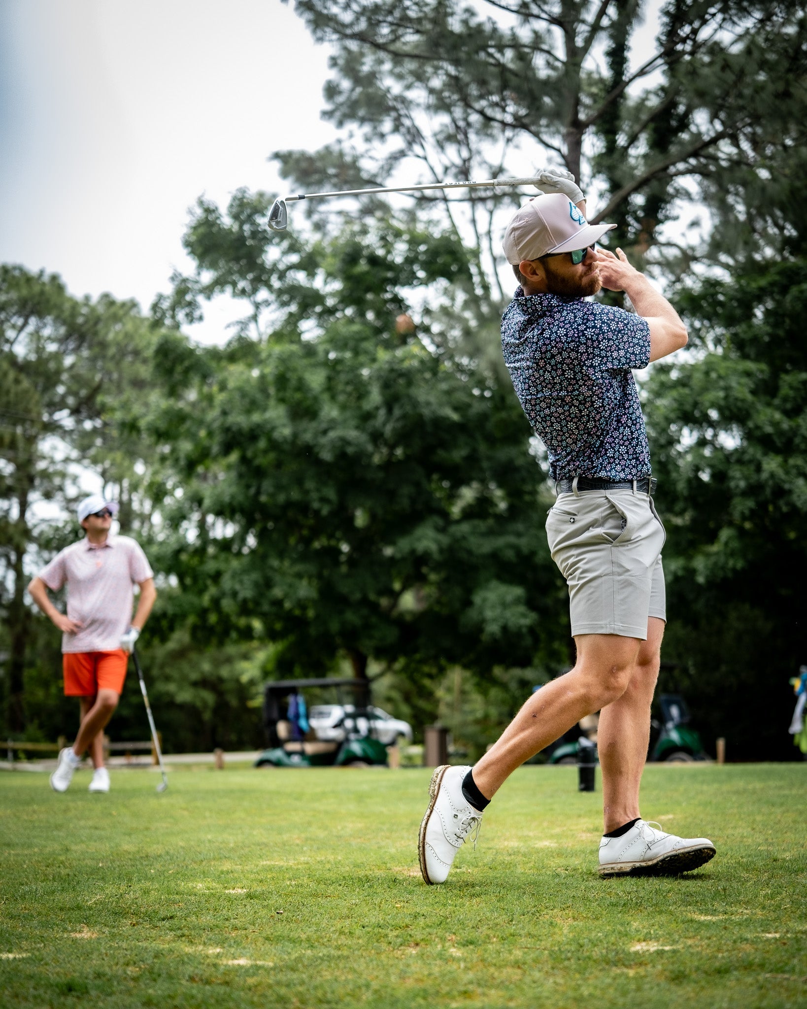 Performance shorts in dark stone color, showcasing a lightweight and breathable fabric design.
