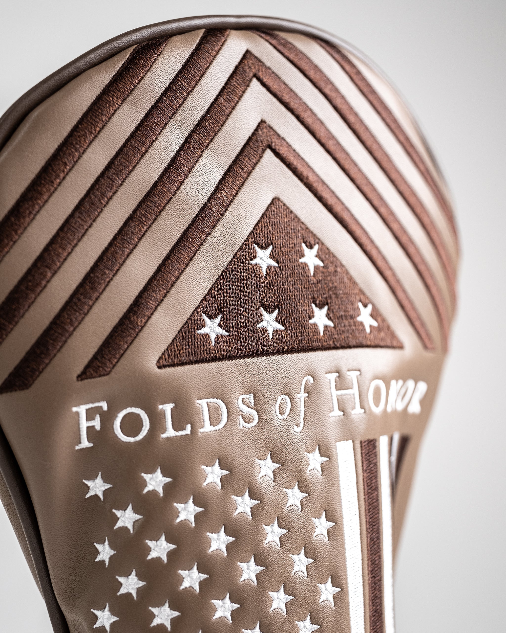 Folds of Honor 2.0 driver cover featuring a sleek design with patriotic colors and logo, designed for golf club protection.