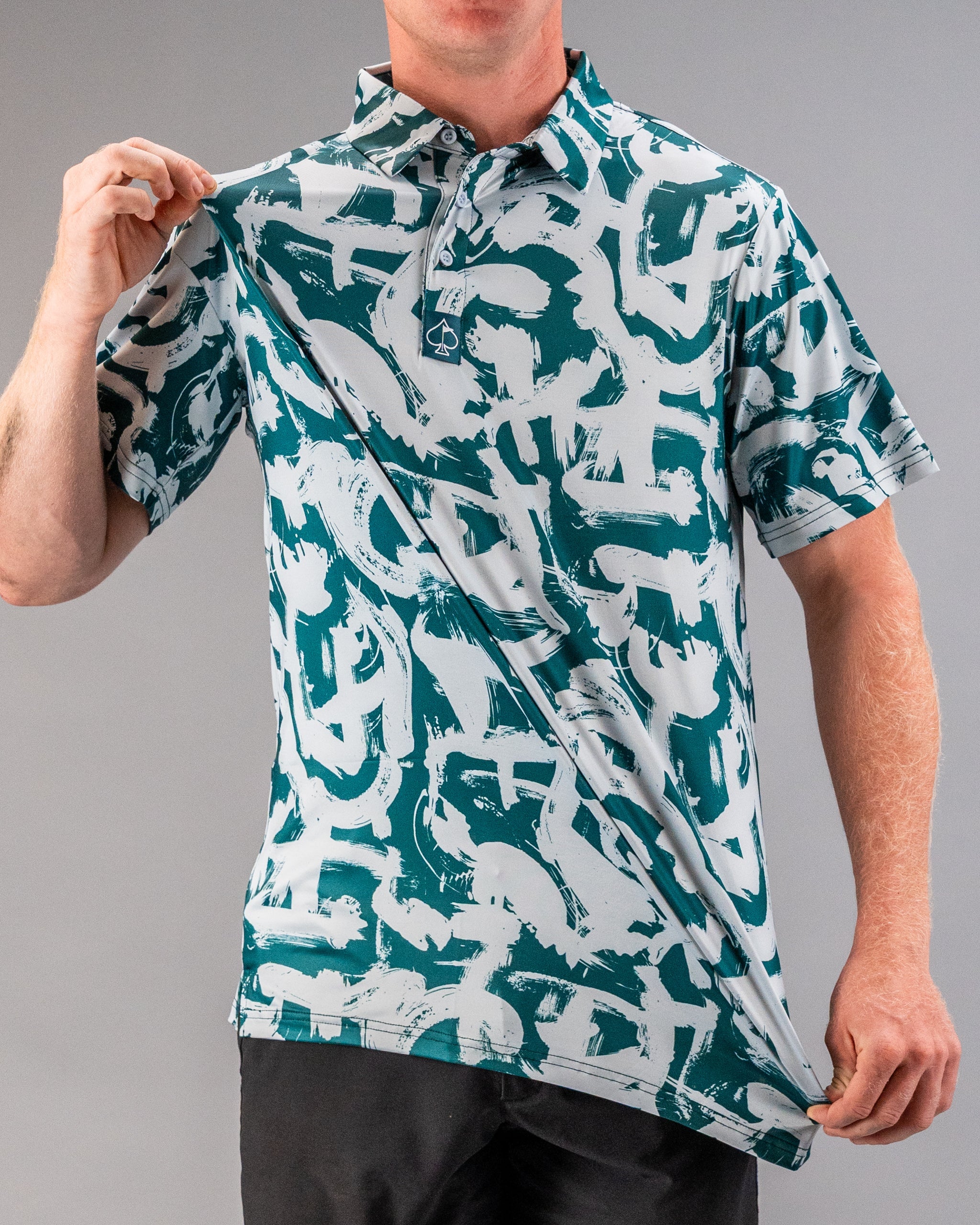 Bold green golf polo featuring an abstract paint stroke design, perfect for golfers looking to make a statement on the course.