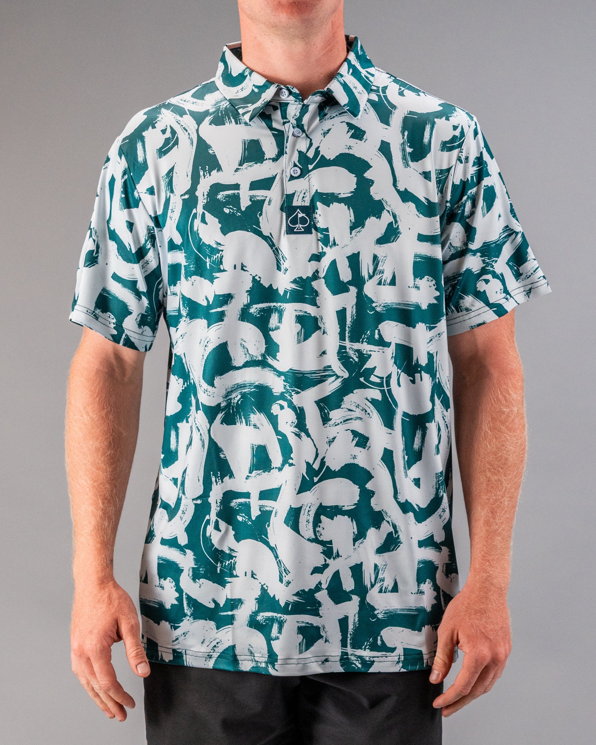 Men's golf polo featuring a bold paint stroke design in green and gray, perfect for stylish performance on the course.