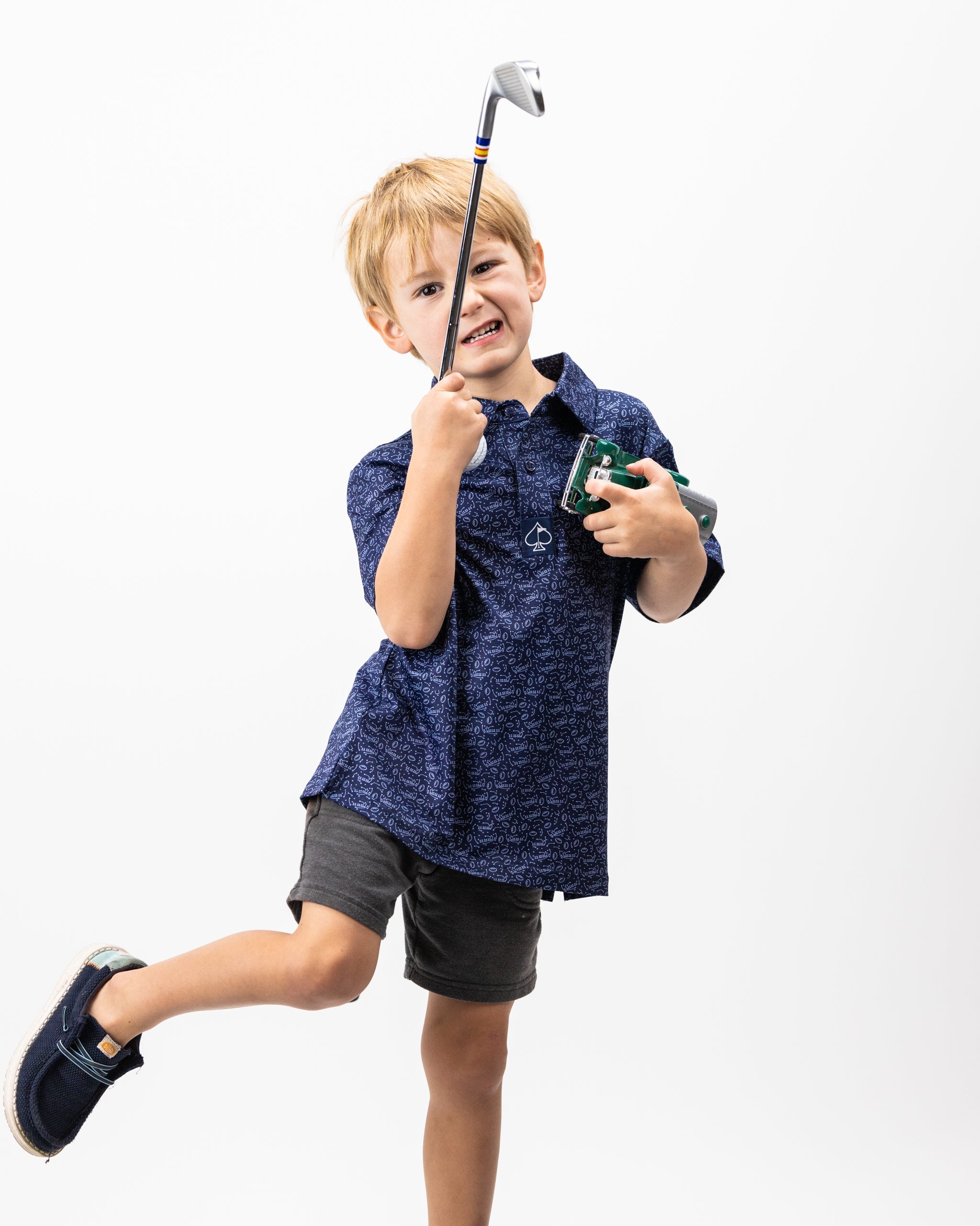 Youth Playmaker polo in vibrant blue with short sleeves and a classic collar, designed for active children.