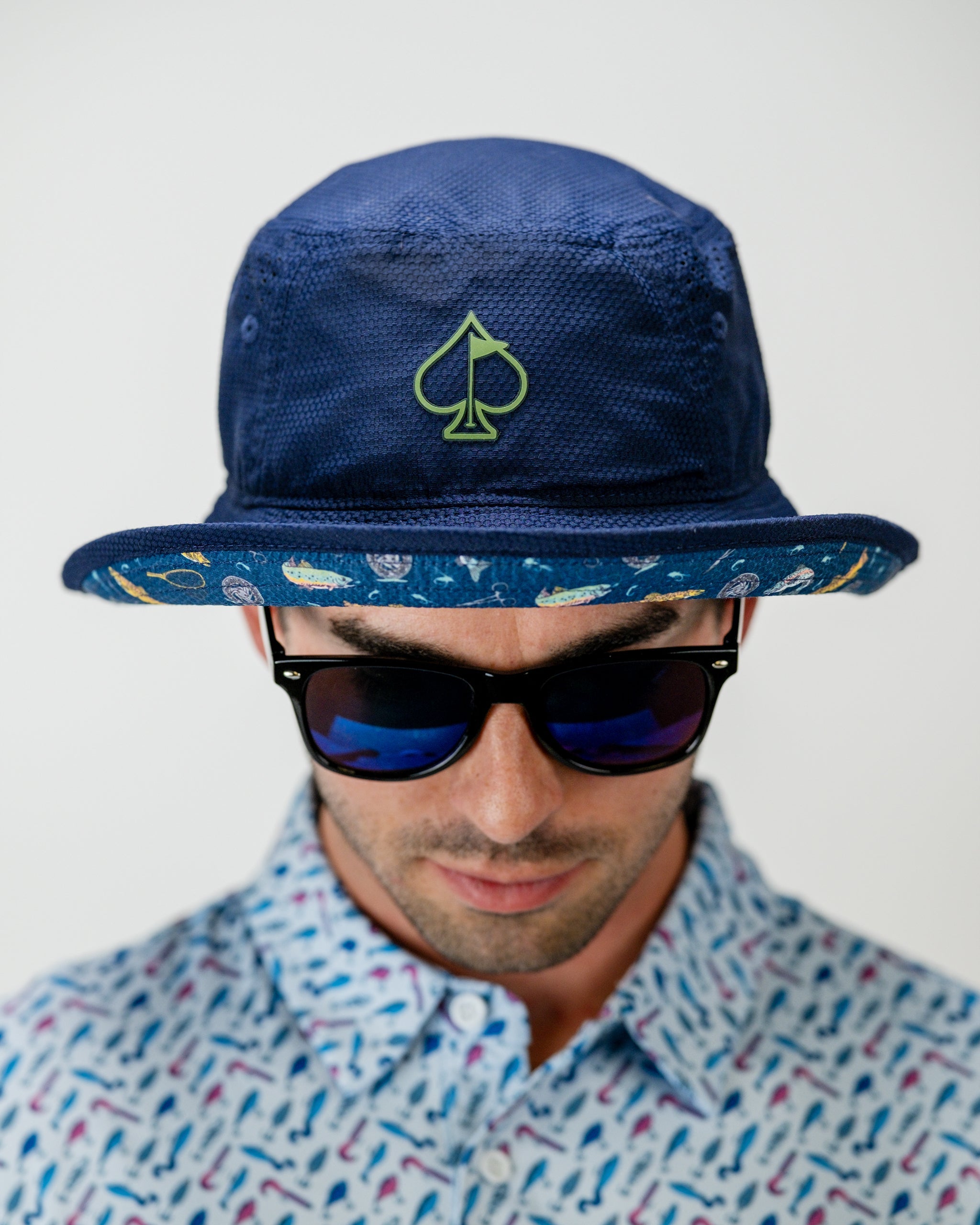 Blue bucket hat featuring a fish graphic with the text "Catch & Release" for outdoor enthusiasts.