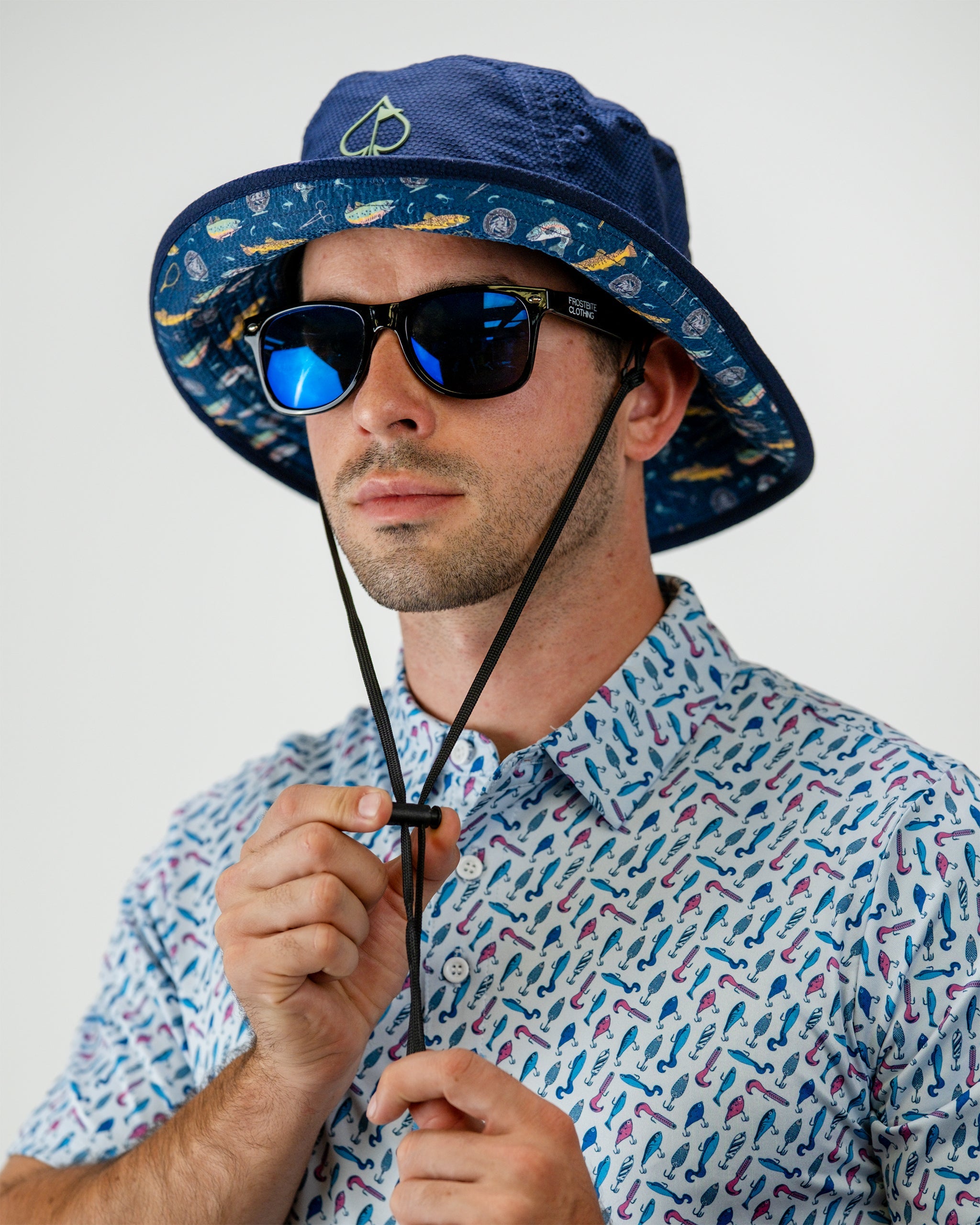 "Catch & Release Bucket Hat featuring a vibrant fish print design, ideal for outdoor activities and fishing enthusiasts."
