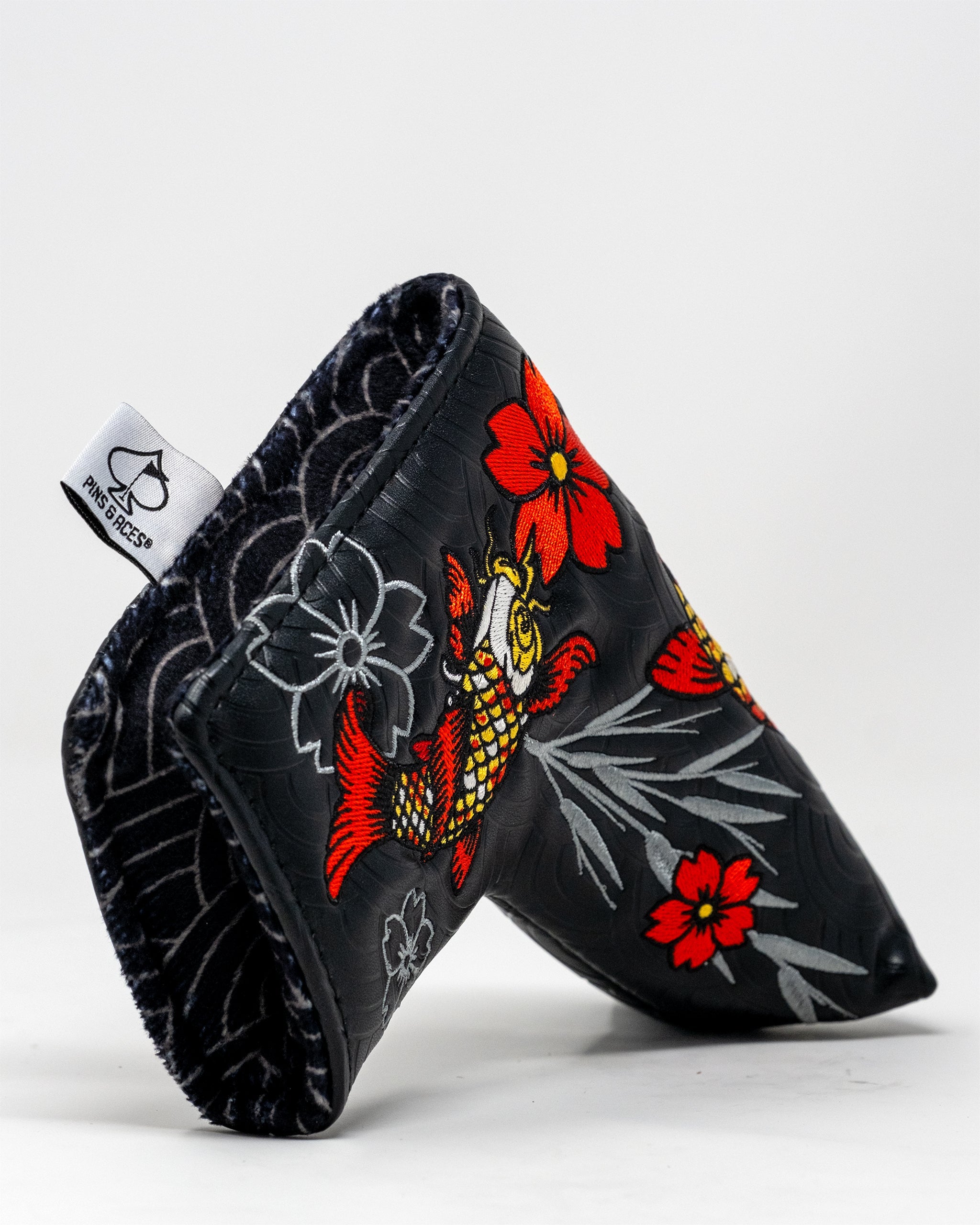 Koi Flow Blade Putter Cover featuring a vibrant fire waves design.