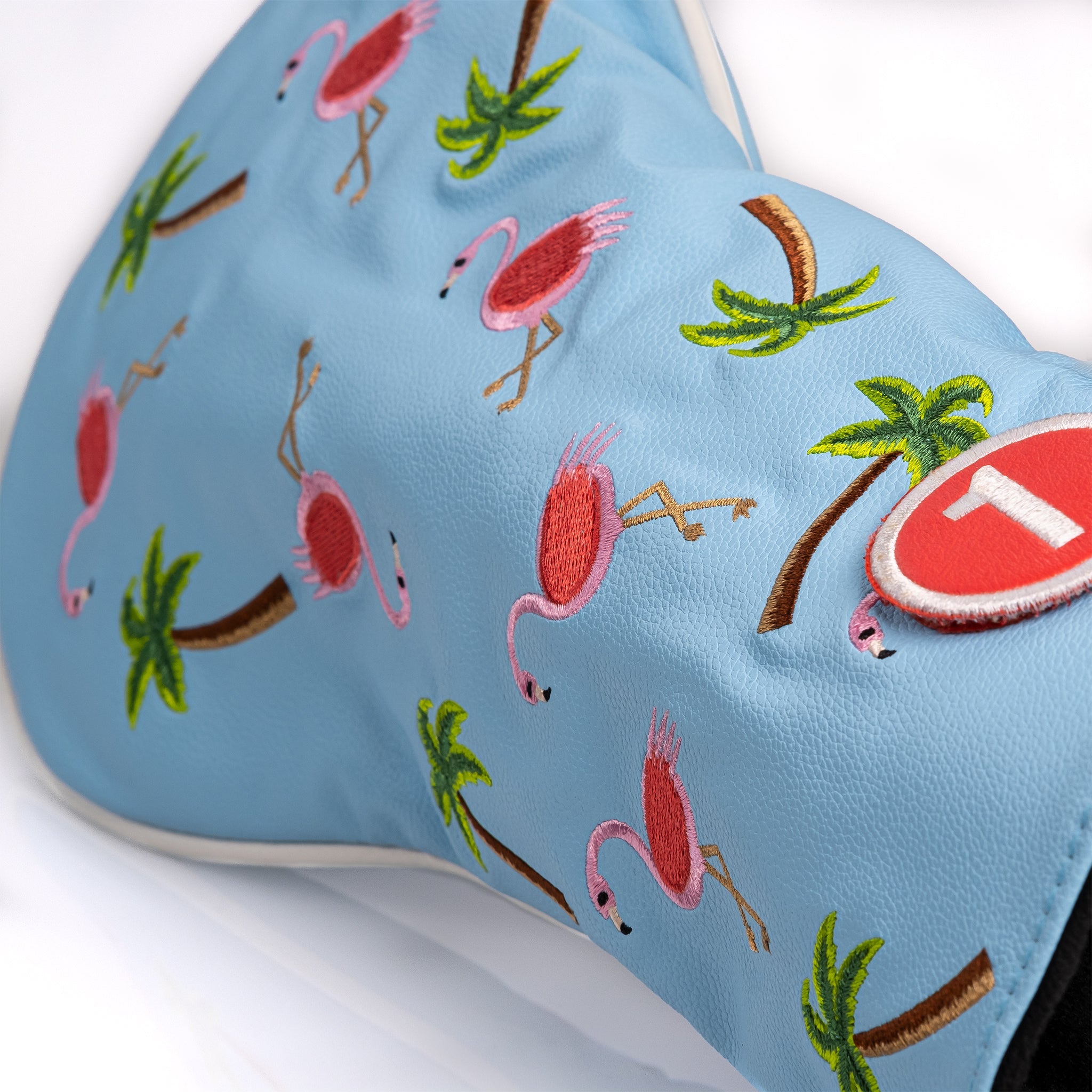 "Dancing flamingos driver cover featuring vibrant colors and playful design for golf clubs."