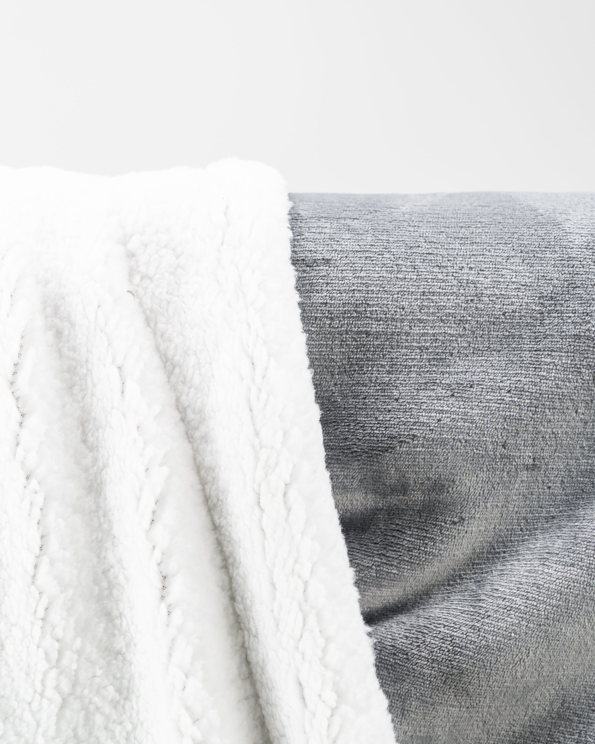 Light gray Bogey Blanket displayed, featuring a soft fleece texture and a cozy design, perfect for comfort and warmth.