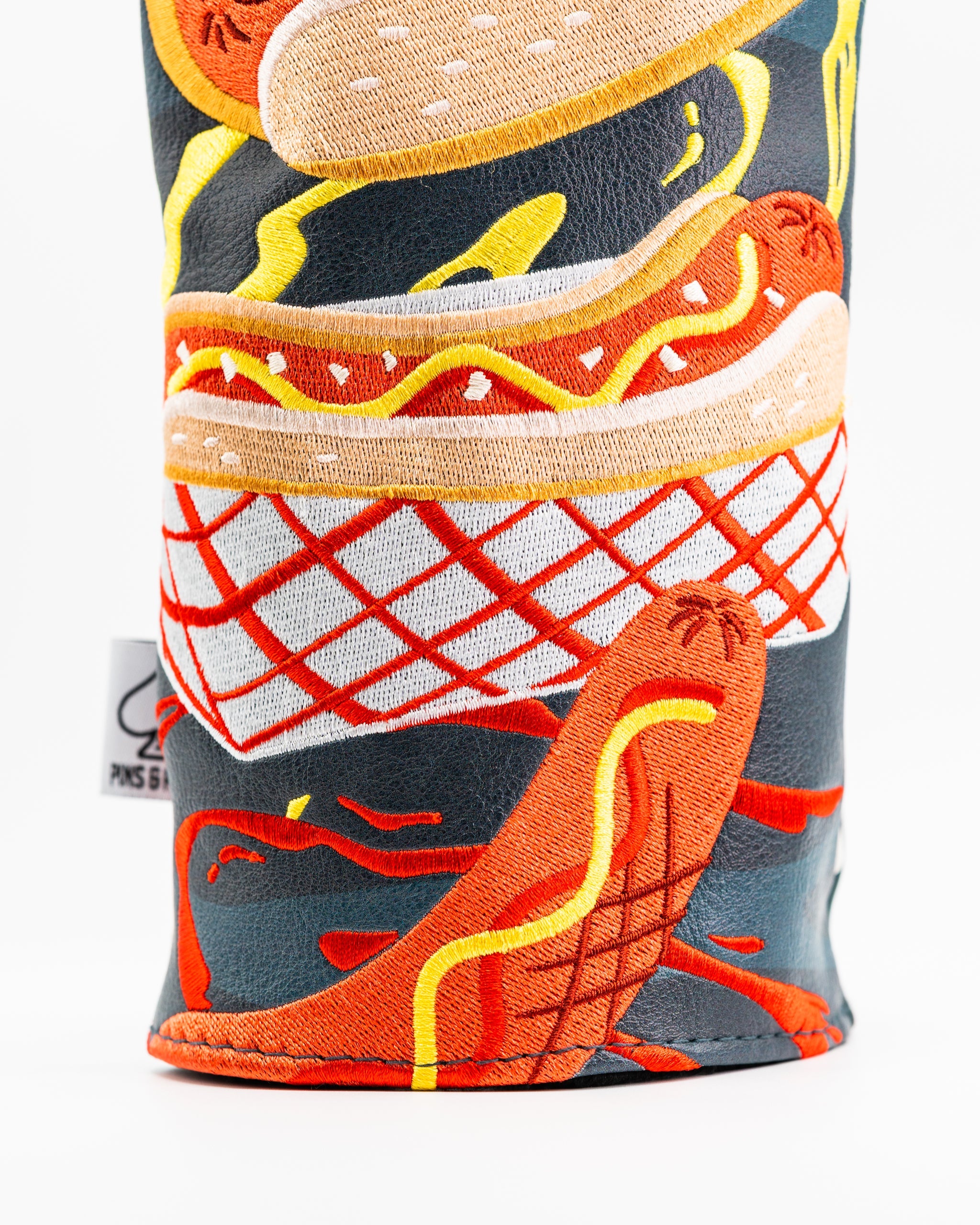 Colorful driver cover featuring playful hot dog and hamburger designs, perfect for adding personality to your golf bag.