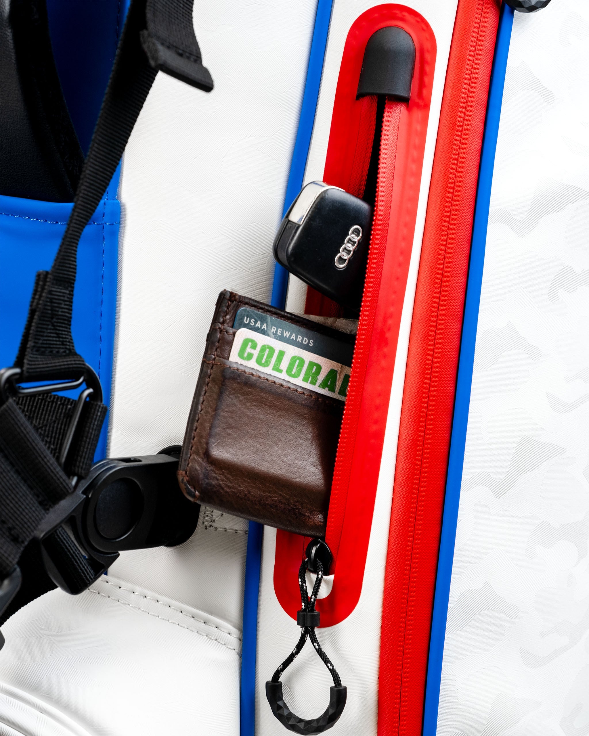 Player Preferred™ Golf Bag in red, featuring multiple compartments, padded straps, and a stylish design with Golf of America branding.